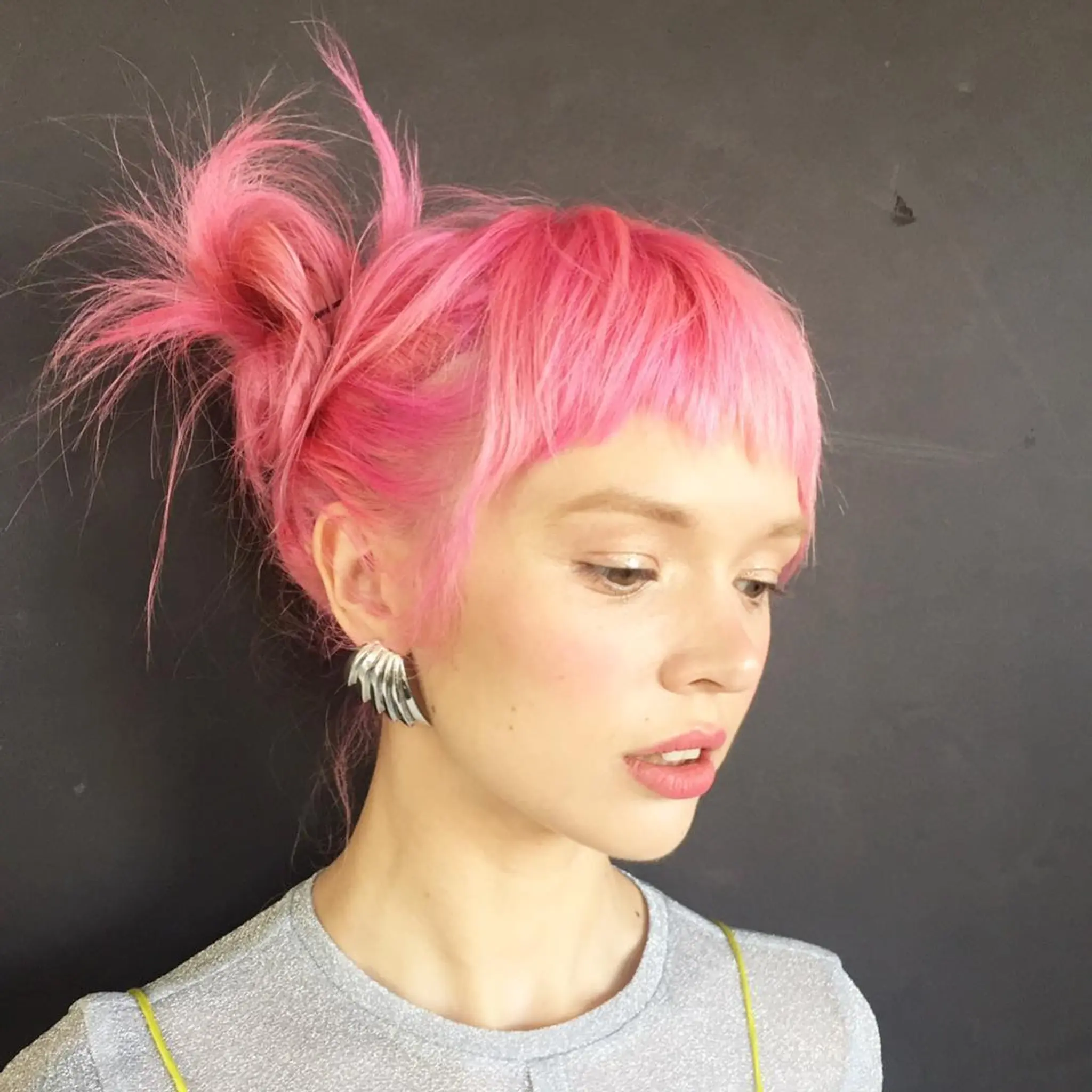 Bright pink updo by @takeohair