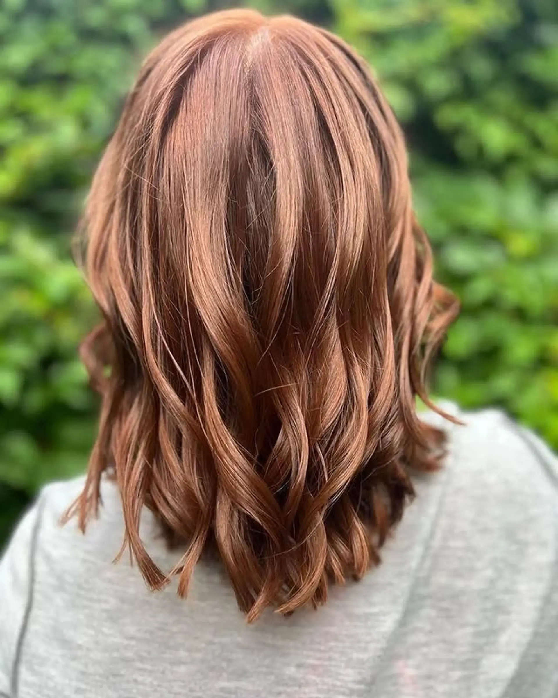 A wavy and layered medium length hairstyle. 1