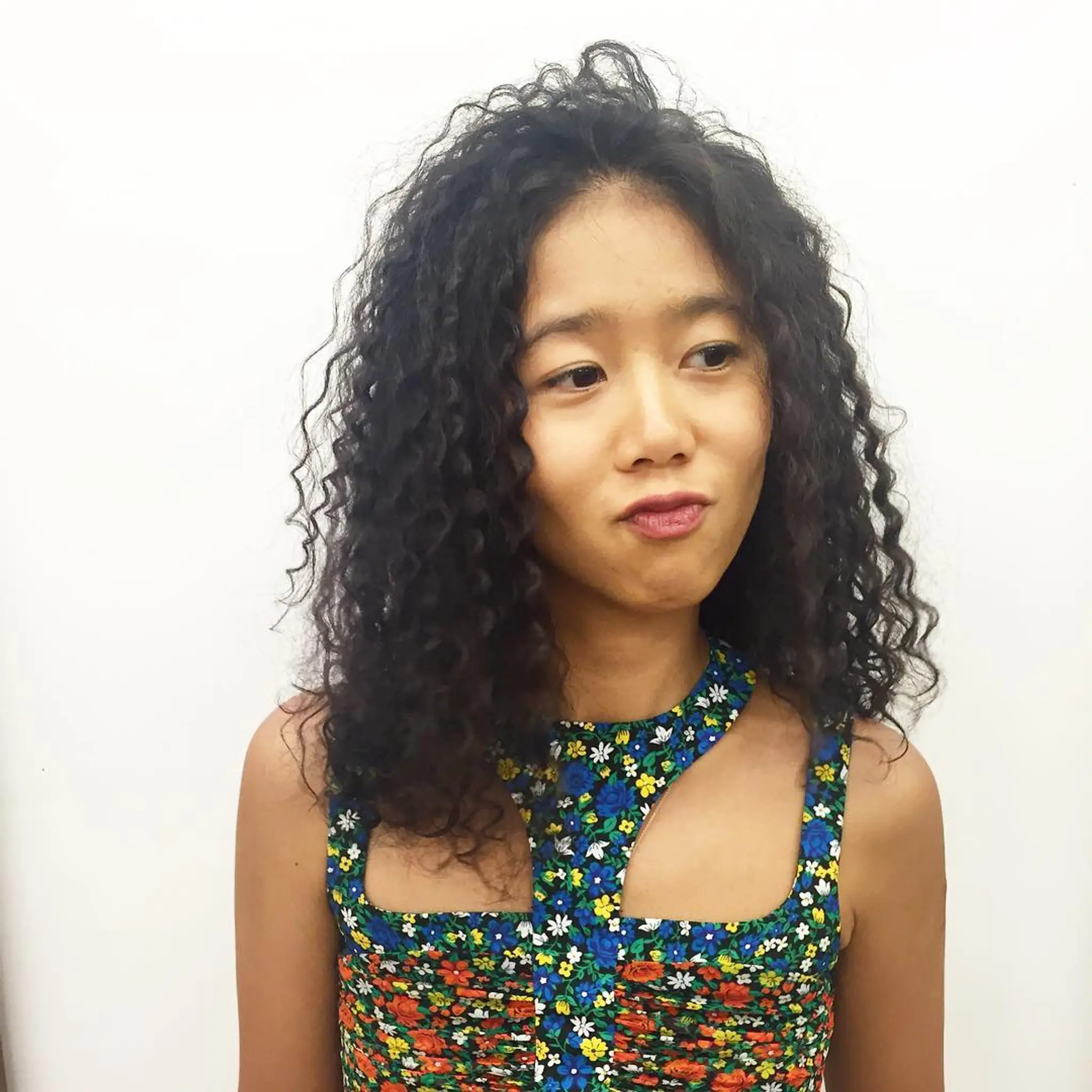 Medium-length black hair with voluminous and defined ringlets forming a lush, full-bodied look. by @takeohair