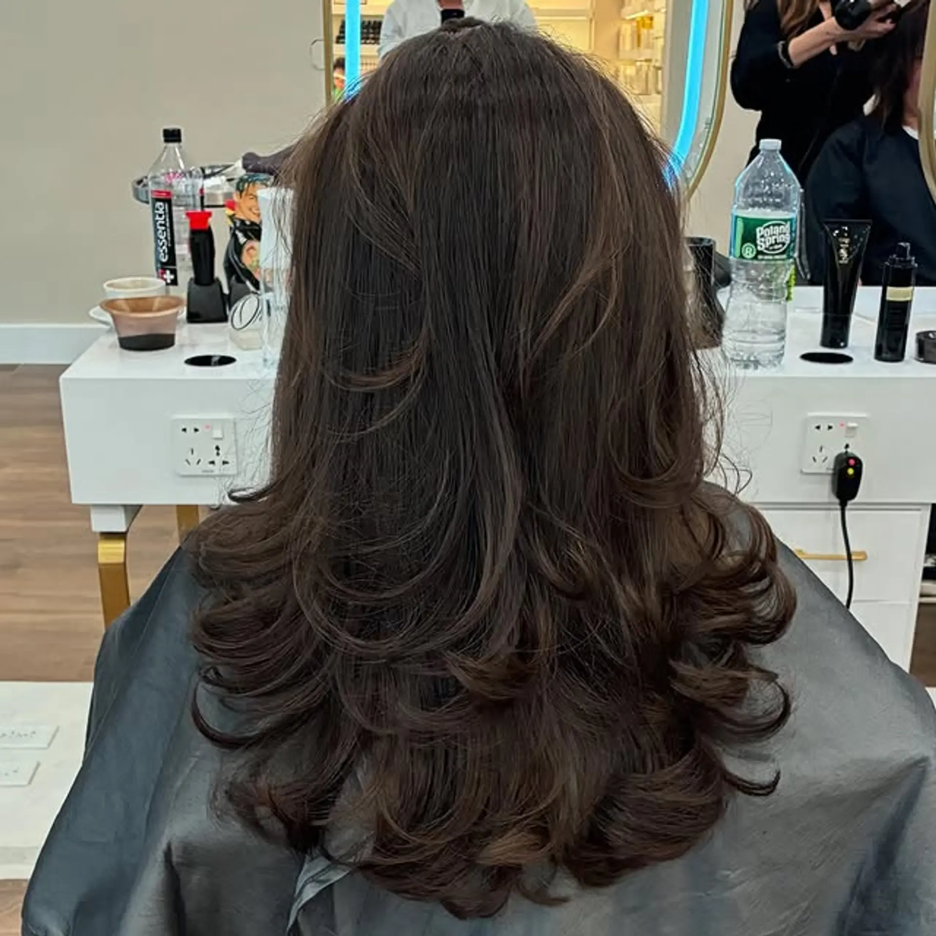 A medium length cut with layers, finished with a slight wave. 1