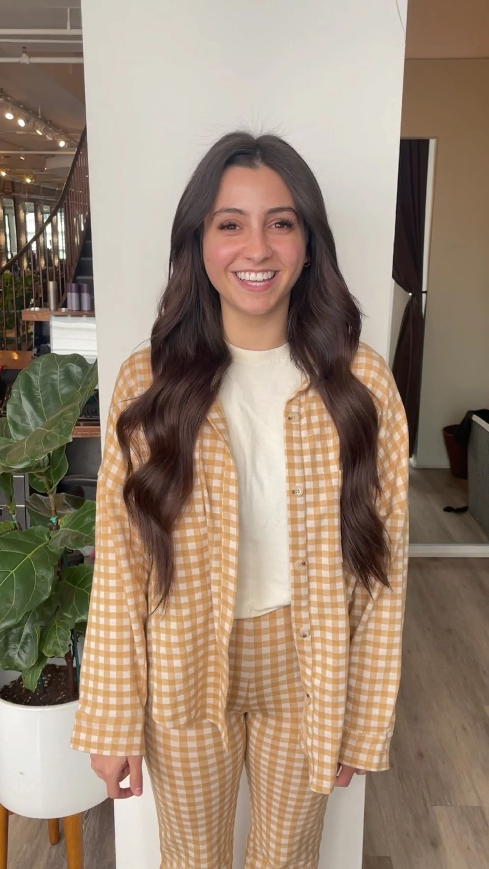 Extra-long dark brunette hair styled with soft, flowing waves and a clean center part. 1