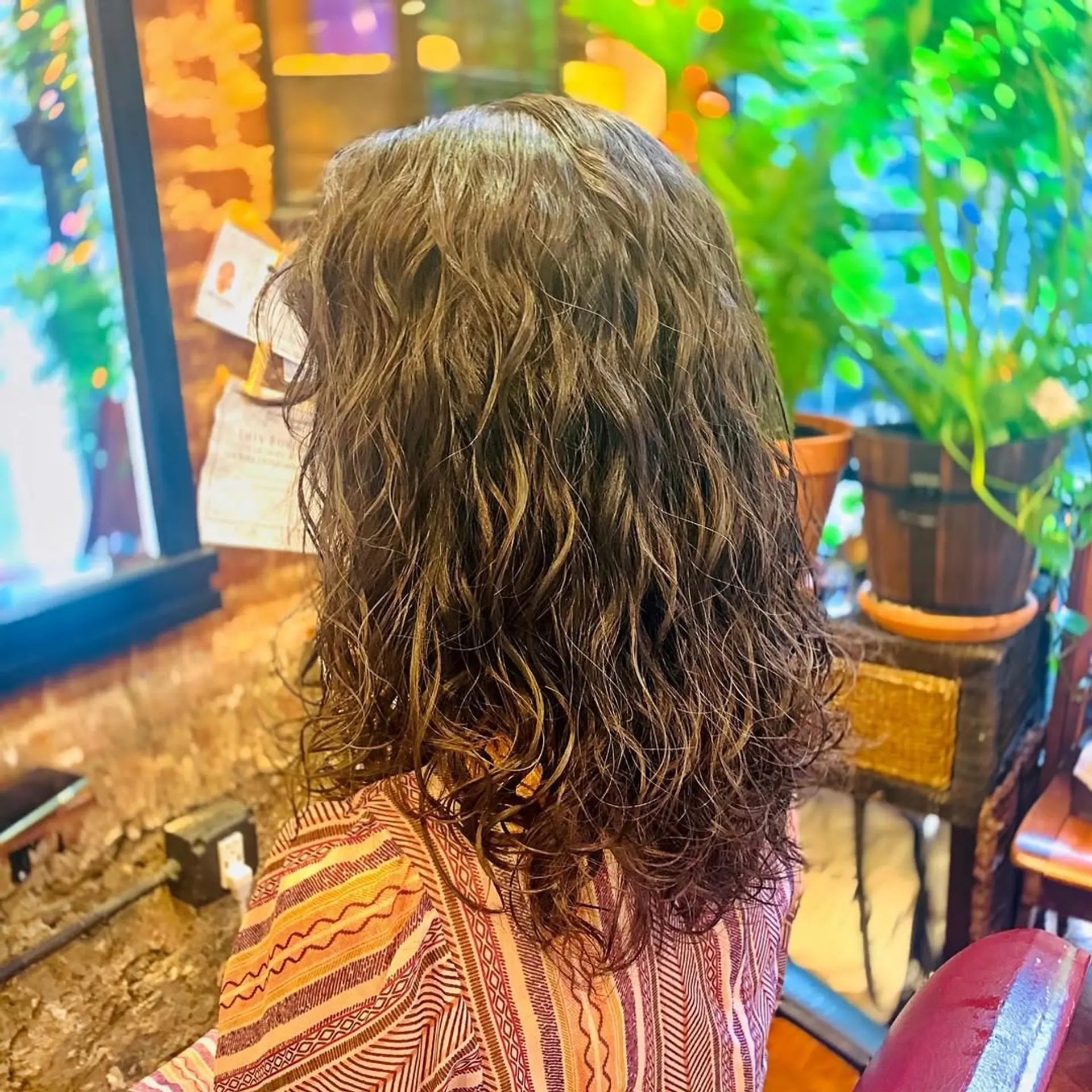 Textured beach waves achieved with a modern perm technique. 1