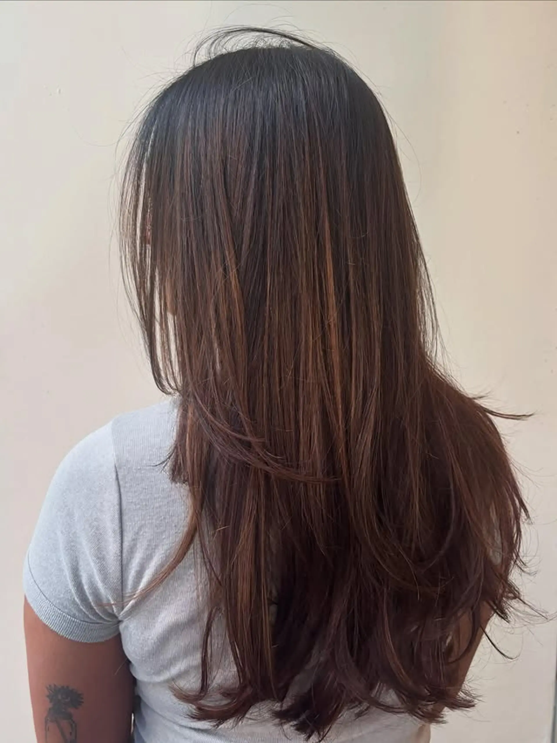 Long layered hairstyle with a balayage. 1