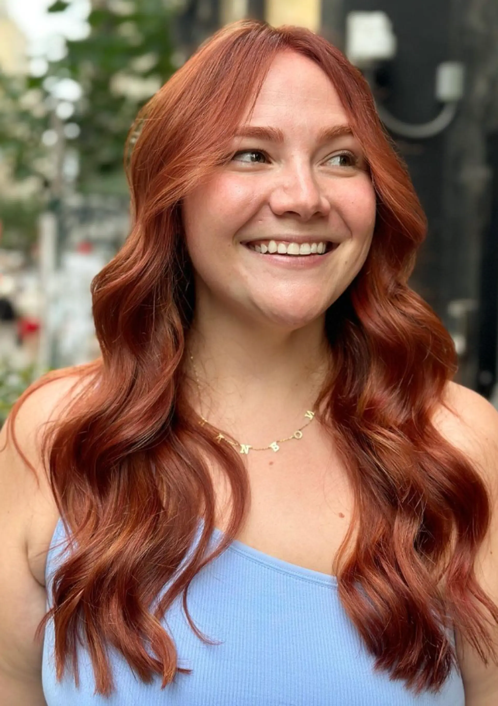 Long, auburn hair with soft, voluminous waves and a middle part, featuring subtle layers for added movement.

Color by @simabeautynyc
Cut and style by @juliamannino_hair
 1
