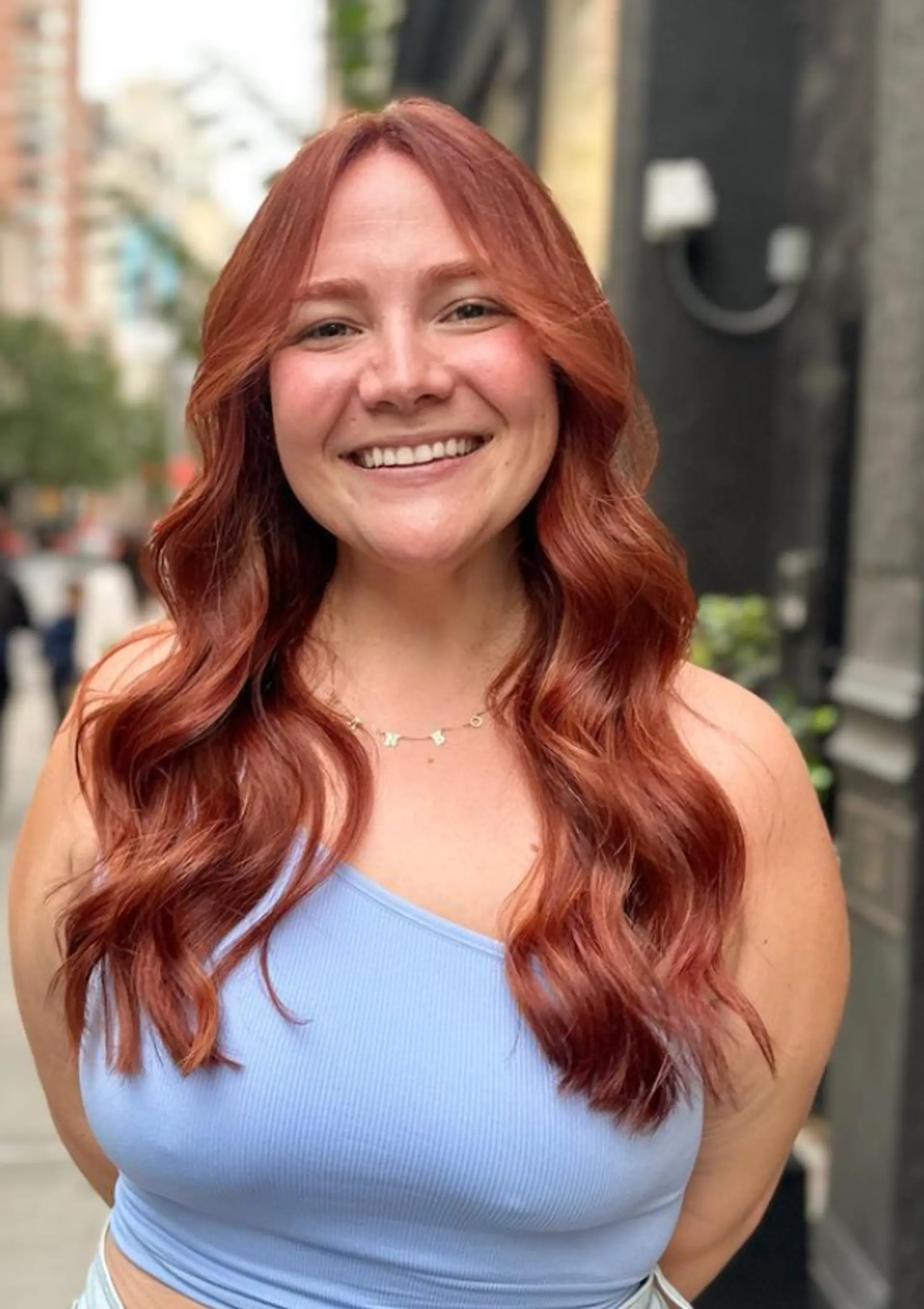 Long, auburn hair with soft, voluminous waves and a middle part, featuring subtle layers for added movement.

Color by @simabeautynyc
Cut and style by @juliamannino_hair
 3