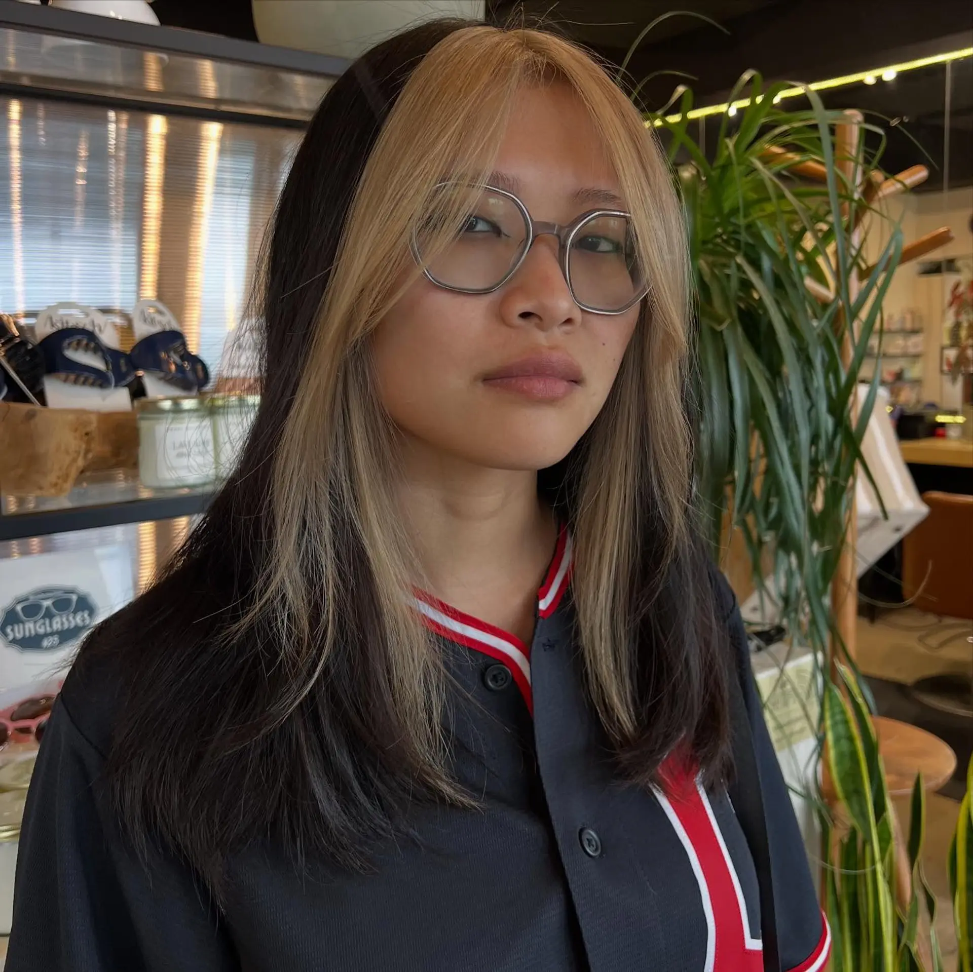 Medium-length dark straight hair featuring a bold, light blonde color-blocked fringe and face-framing sections. 1