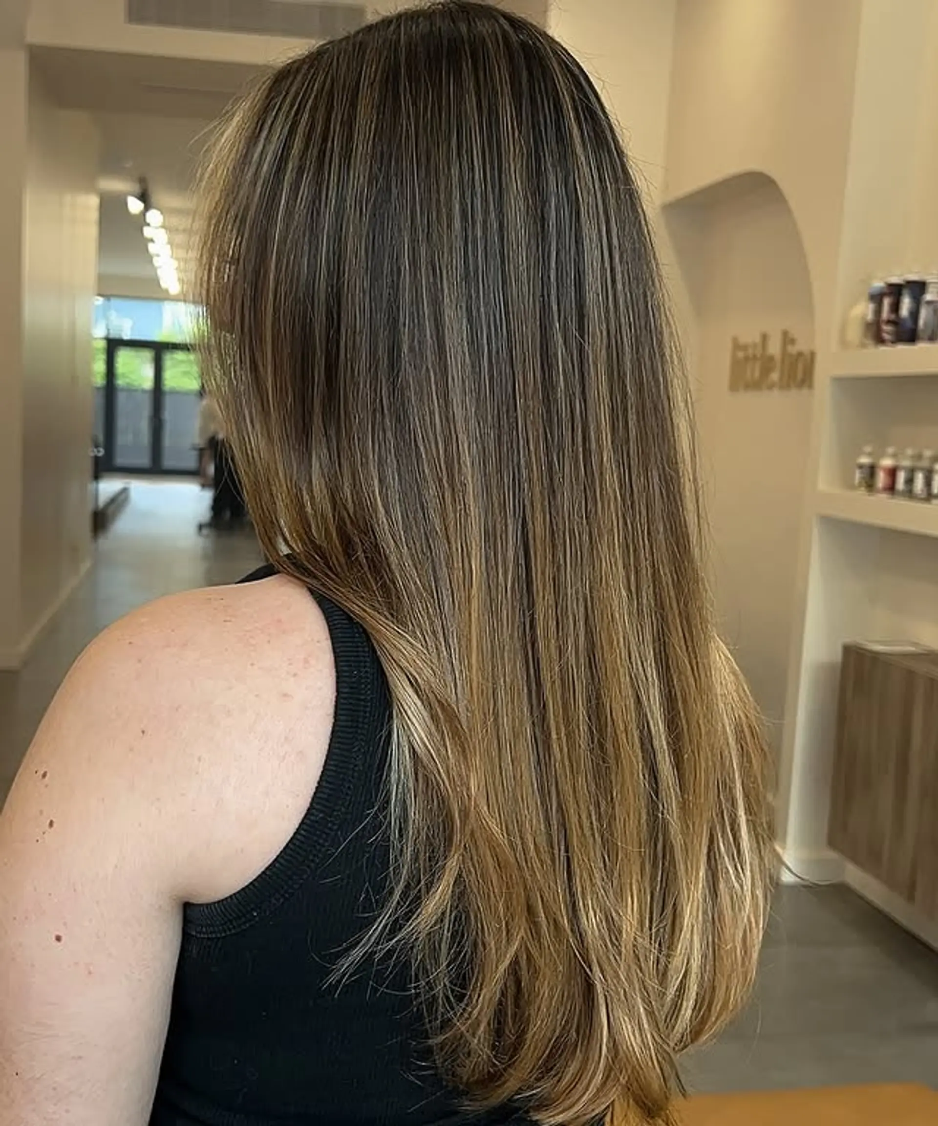 Long layered hairstyle with a bronde balayage. 1