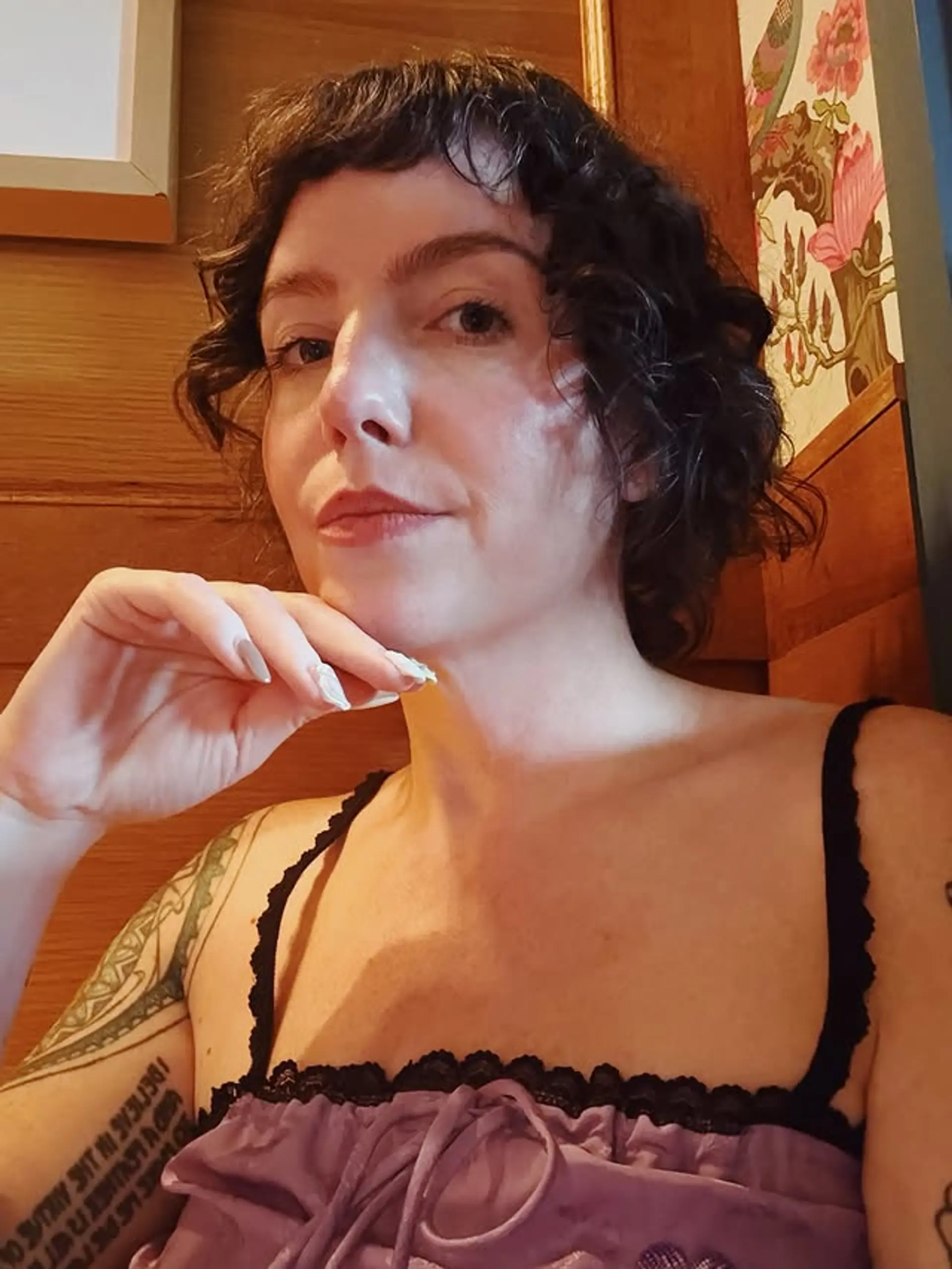 A short, curly shag with baby bangs. 1