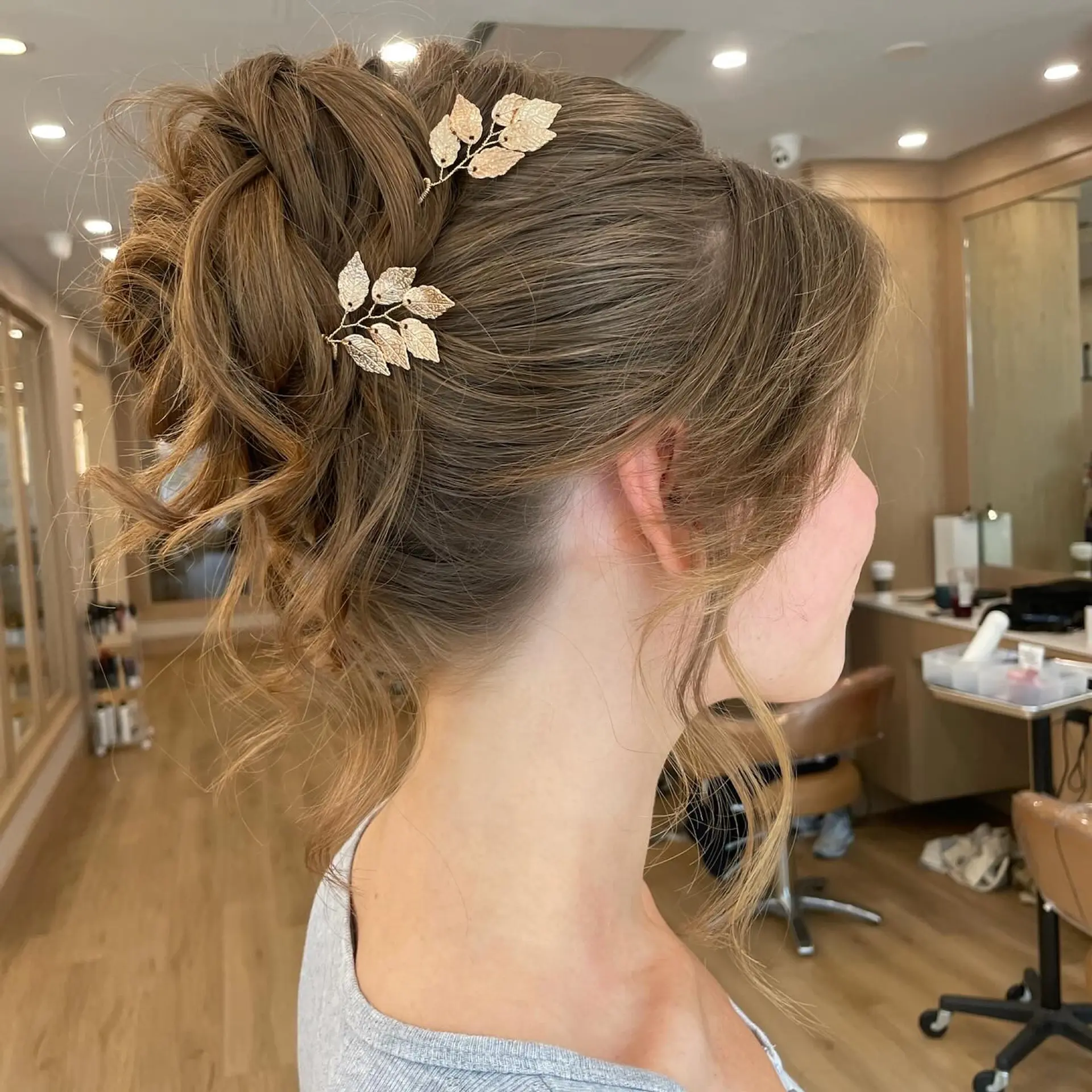 A textured and intricately styled updo, perfect for formal occasions. 1