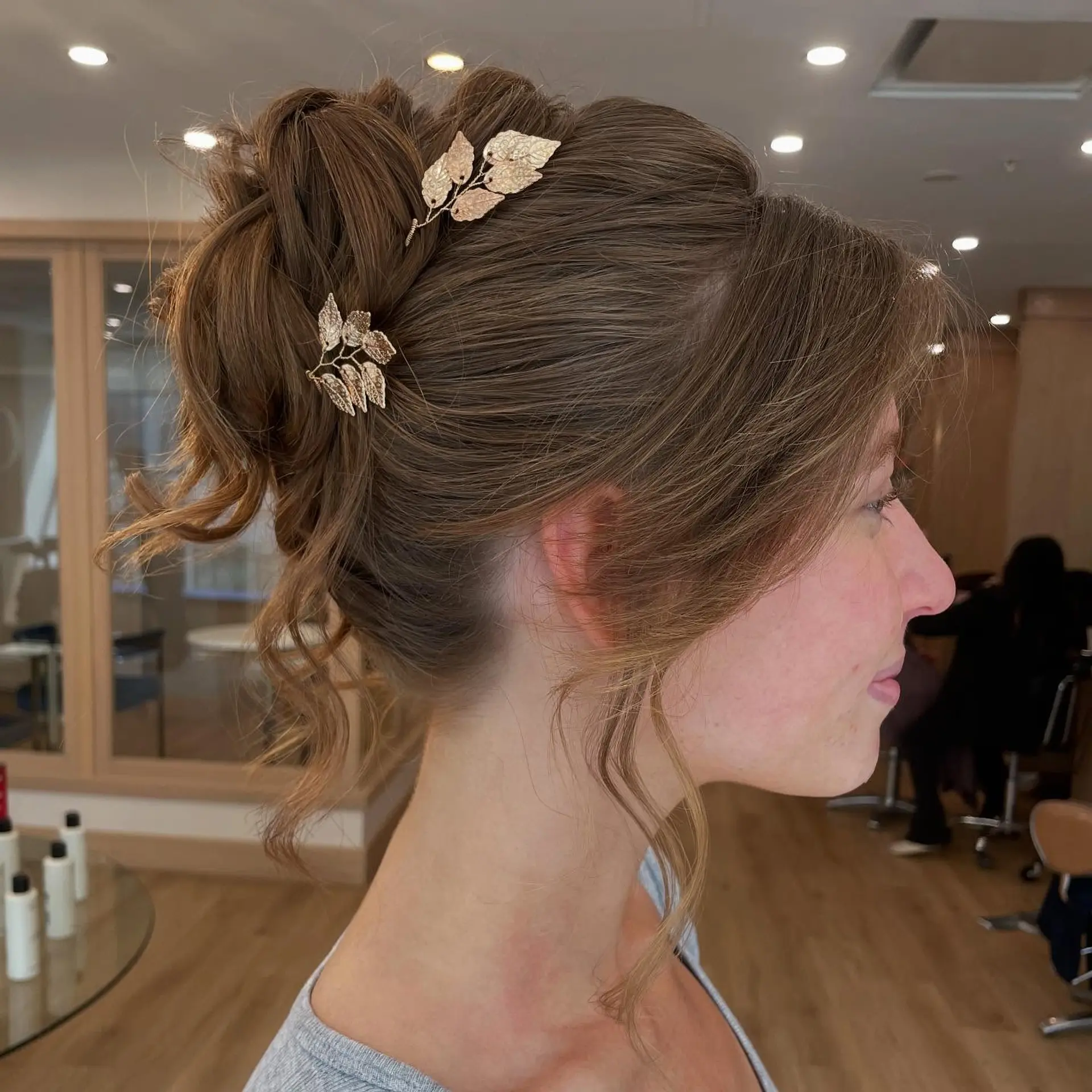 A textured and intricately styled updo, perfect for formal occasions. 2