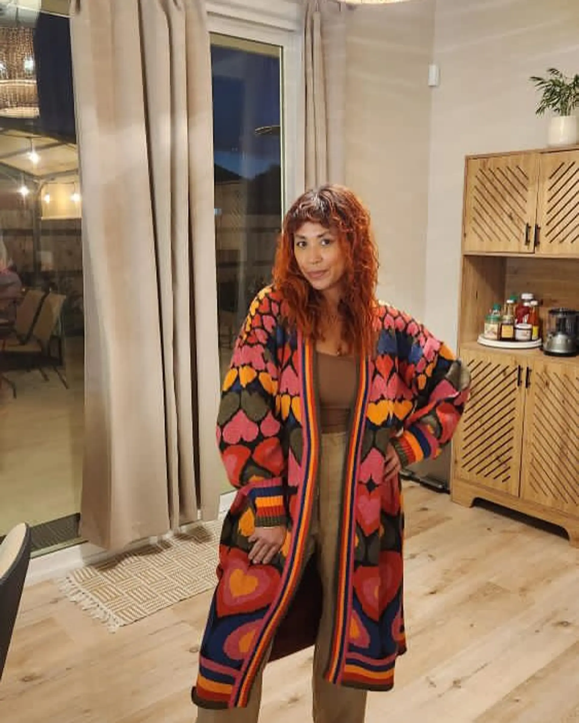 A medium length shag haircut with blunt bangs and lots of layers. 1