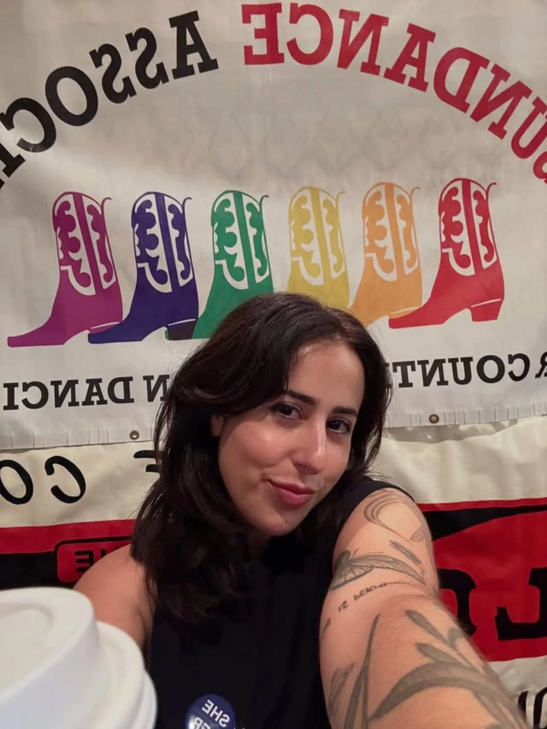 A wavy medium-length hairstyle with curtain bangs and face-framing layers. 1