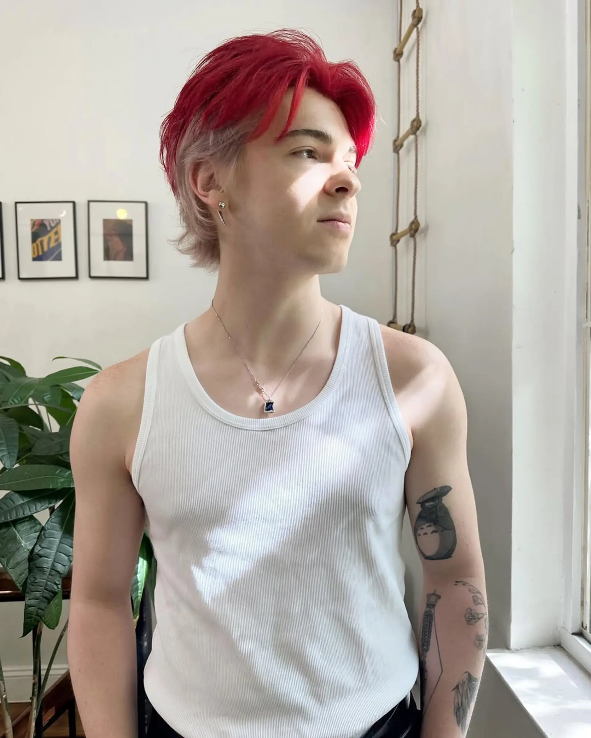 A trendy, two-toned mullet with a bold red top and lighter blonde underneath. The wavy texture adds volume and edginess. 1