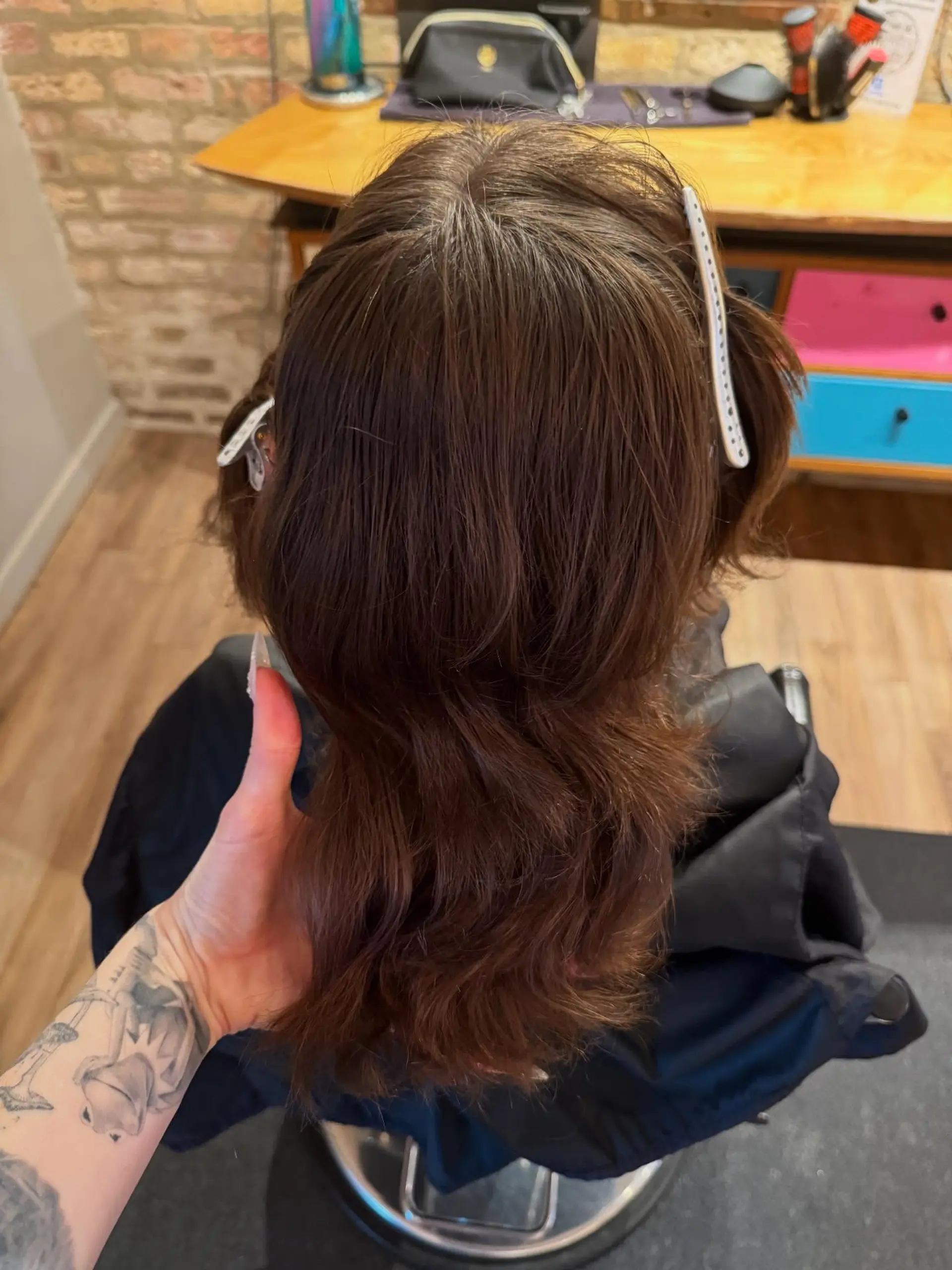 A modern mullet with choppy layers and a bold pink color. 3