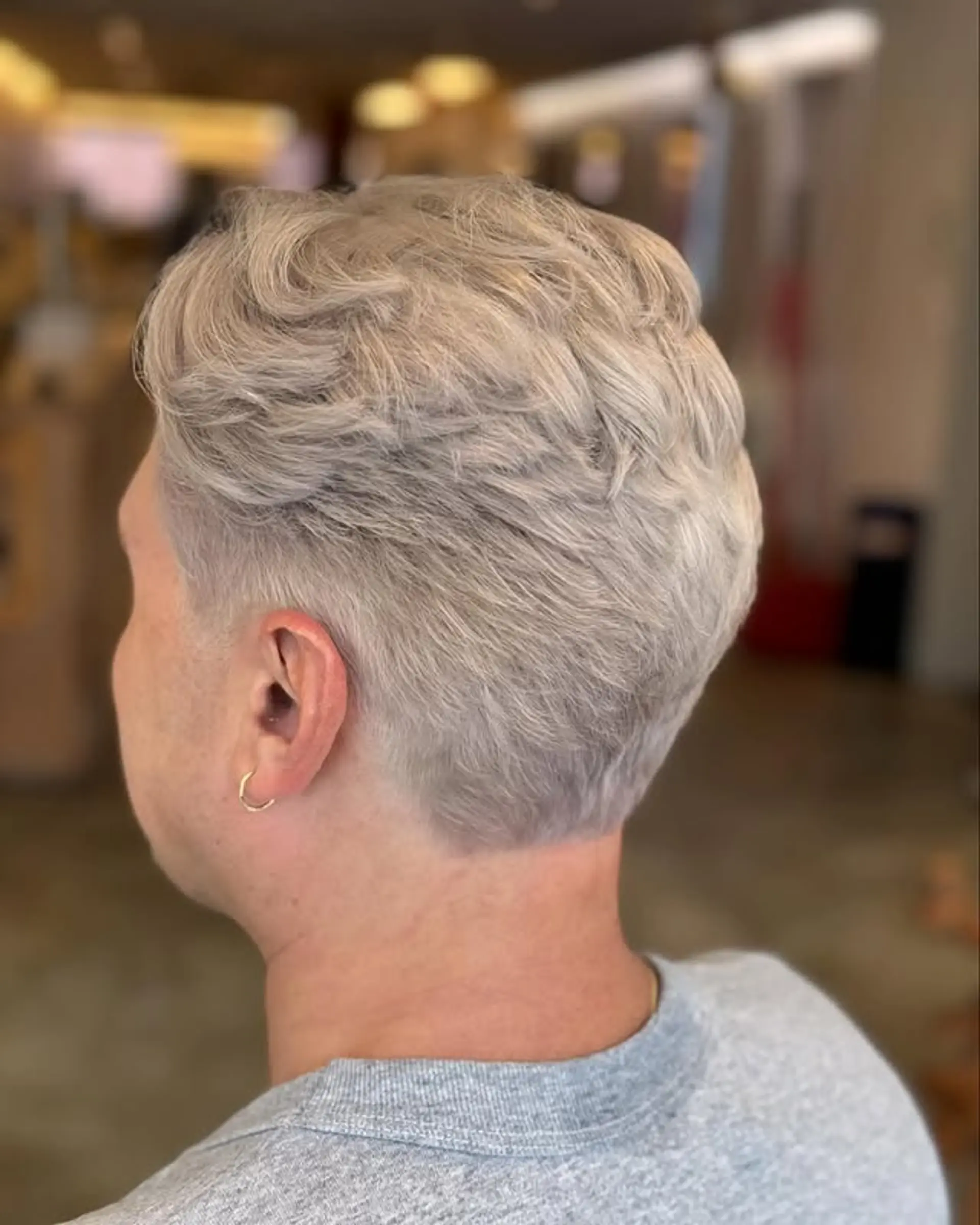 A short, textured crop with a fade. 1