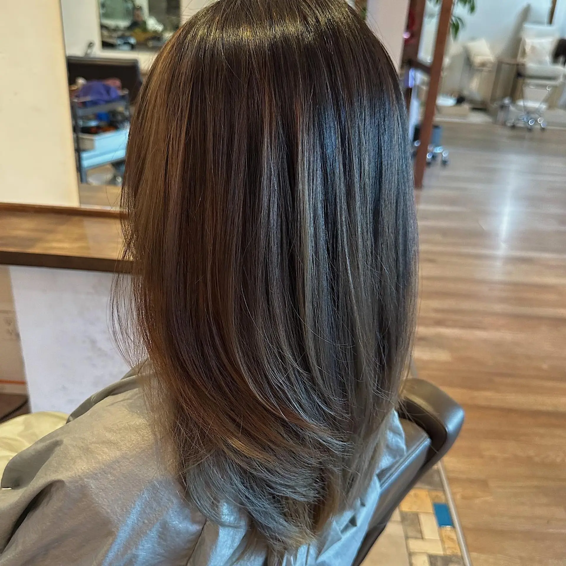 A layered lob with subtle bronzed highlights. 1