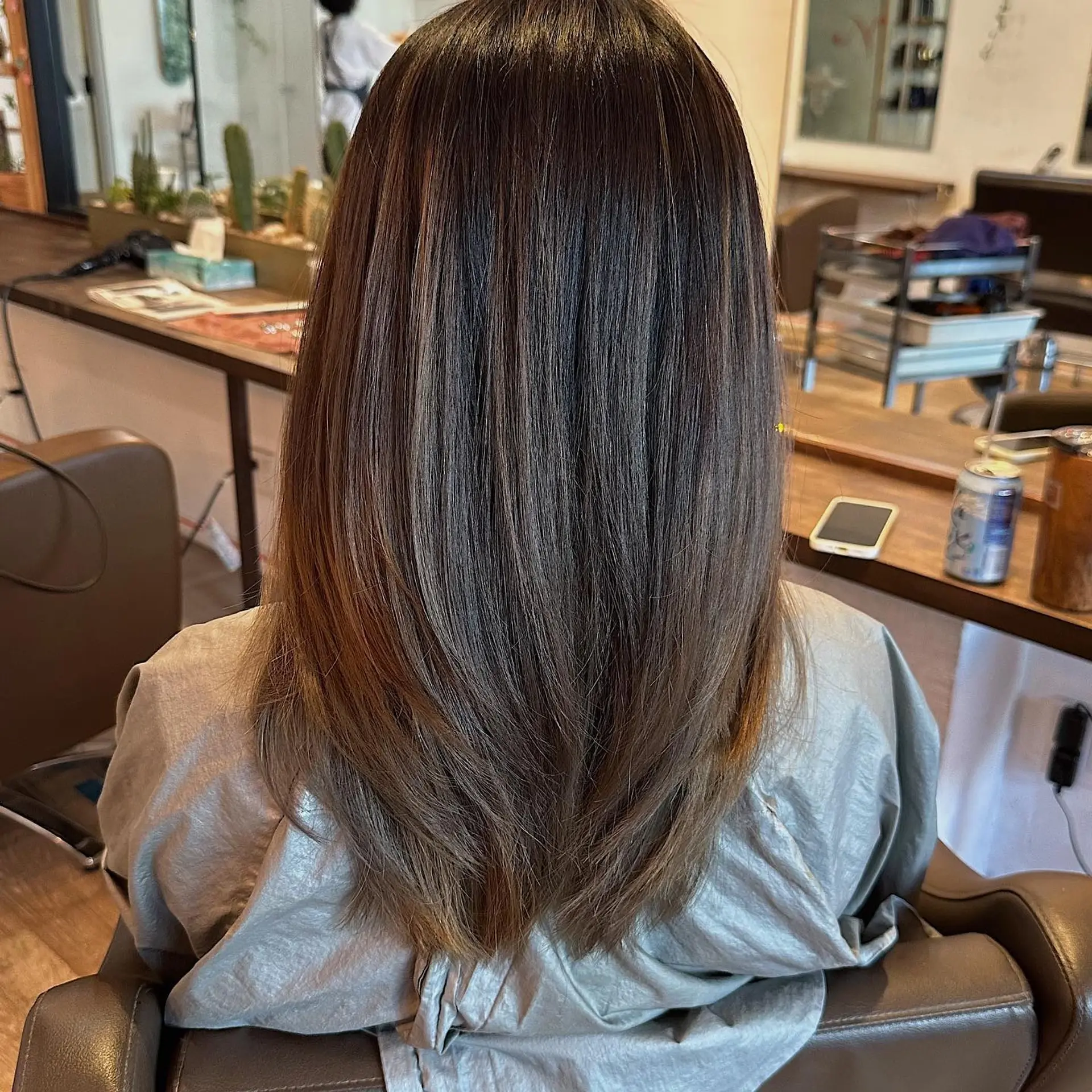 A layered lob with subtle bronzed highlights. 2