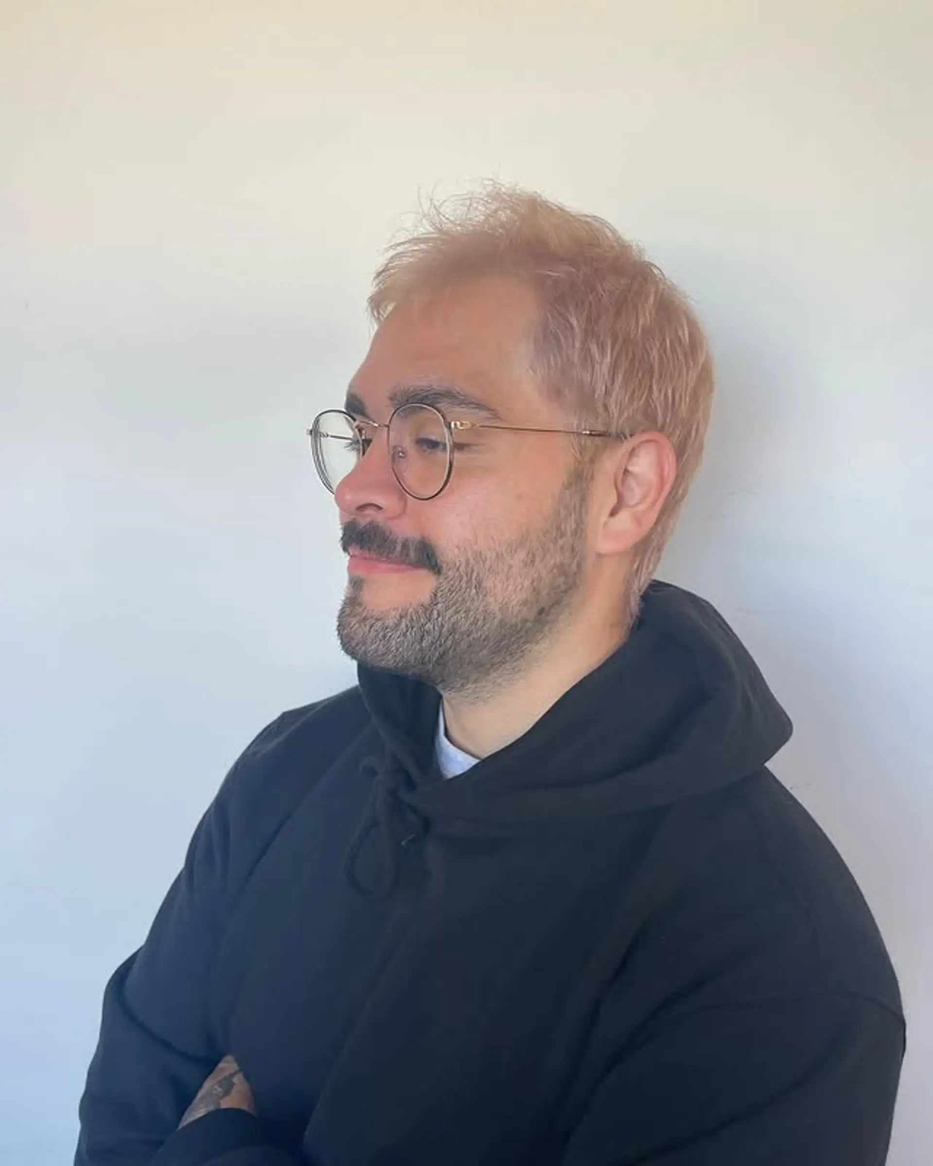 A short and trendy short cut dyed a peach blonde color. 1