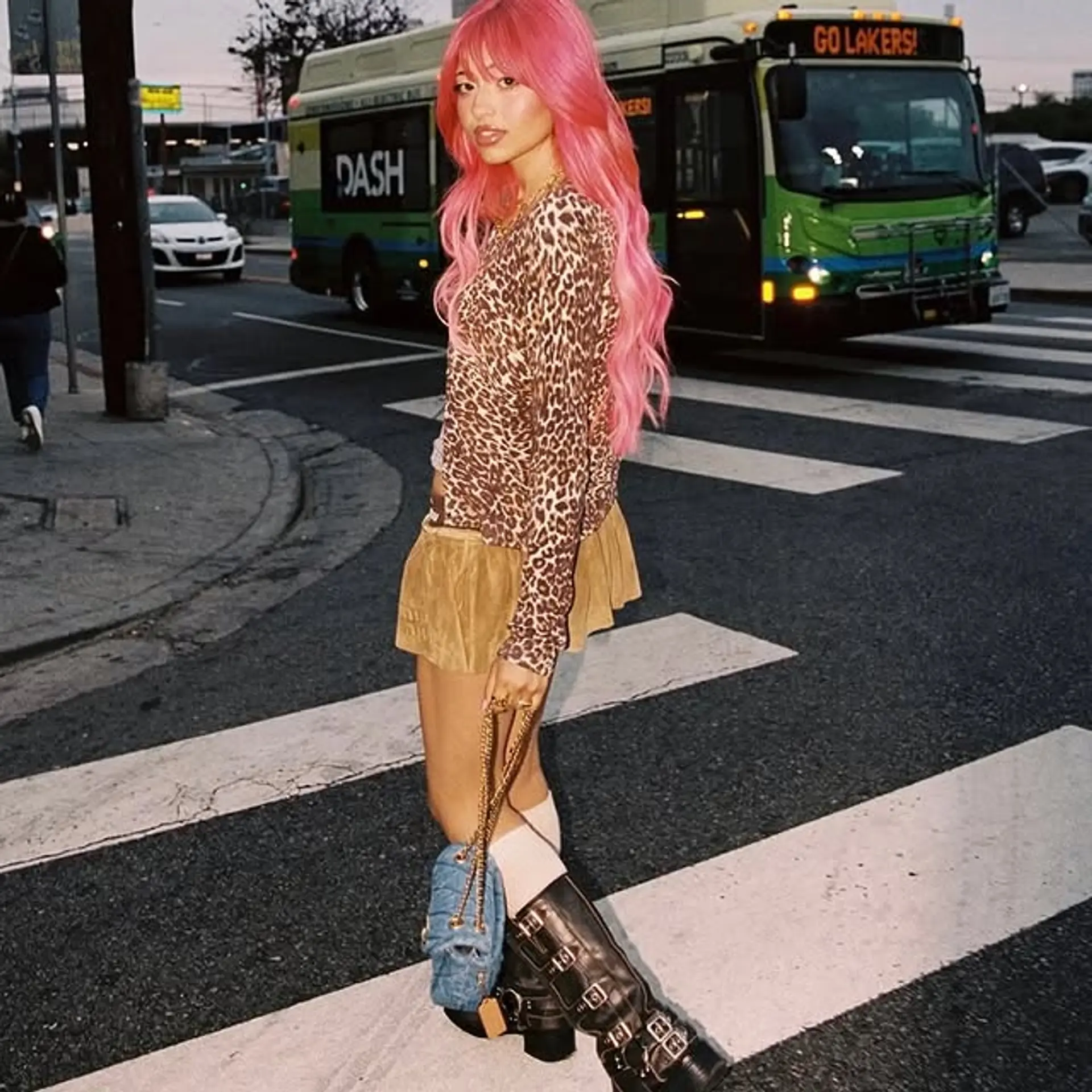 A medium-length wavy shag haircut with full, eye-length bangs and lots of layers. 1