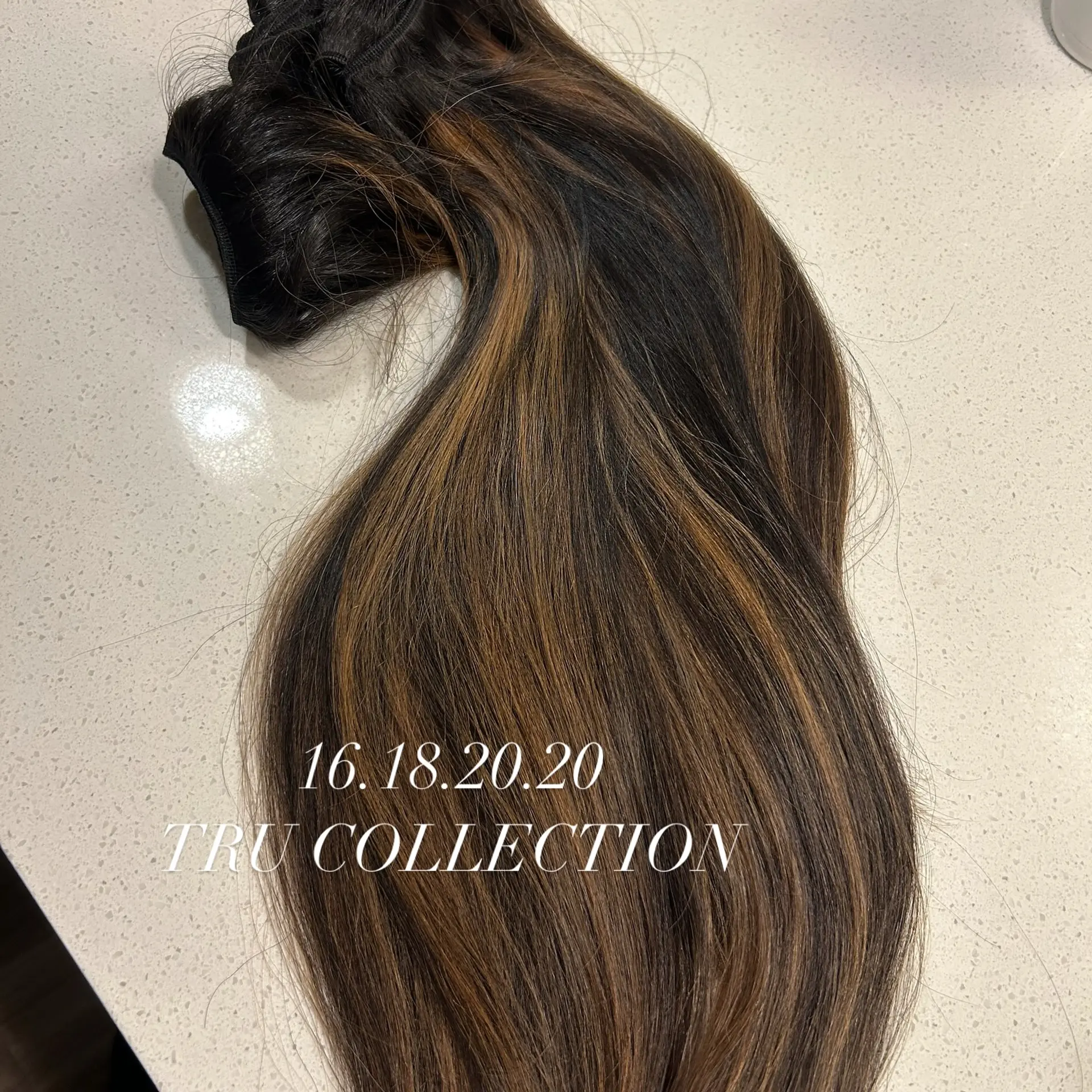 A long, layered hairstyle with waves and balayage highlights. 2