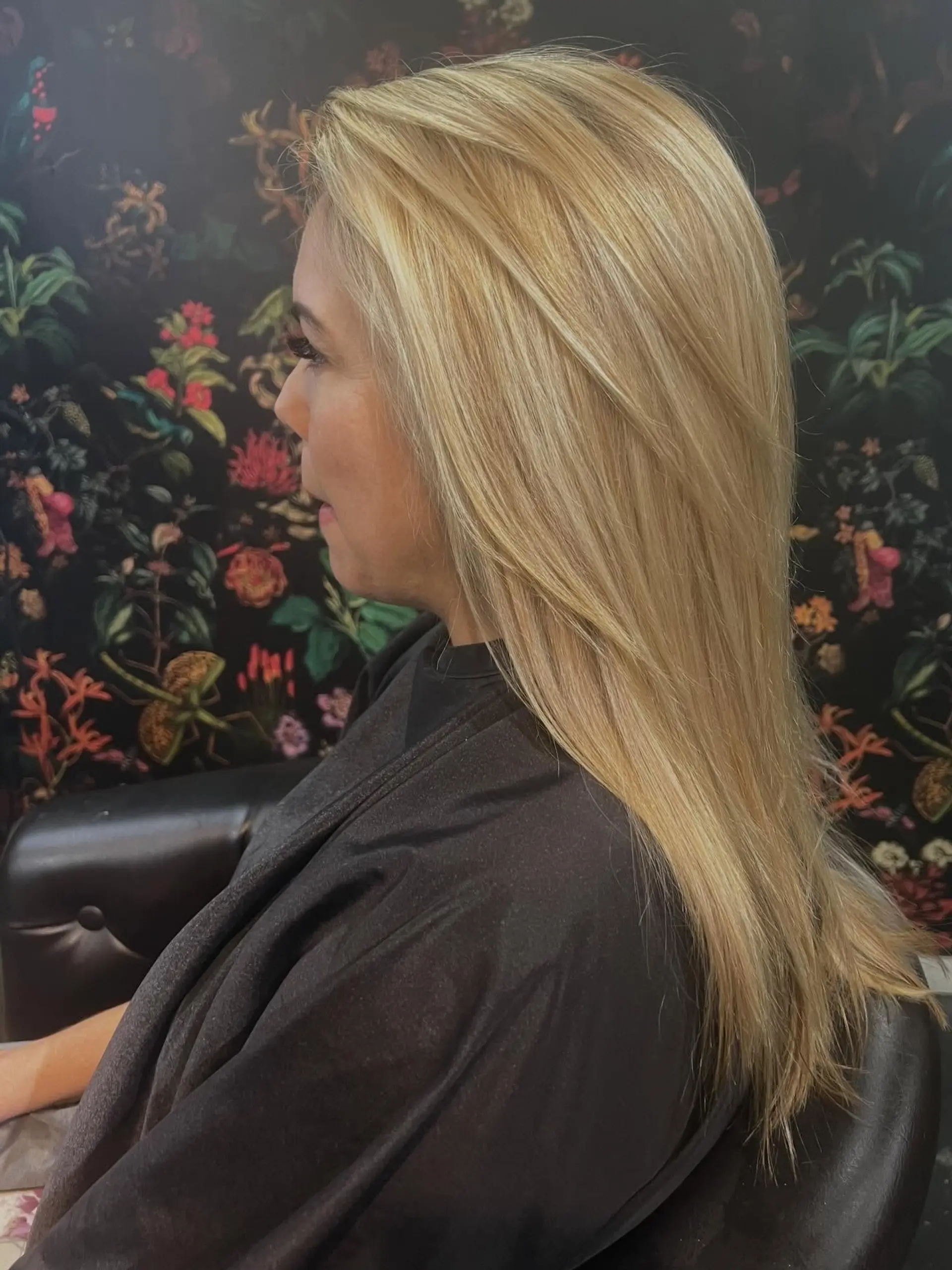 Long straight blonde hair styled with subtle face-framing layers and a smooth, polished blowout. 1