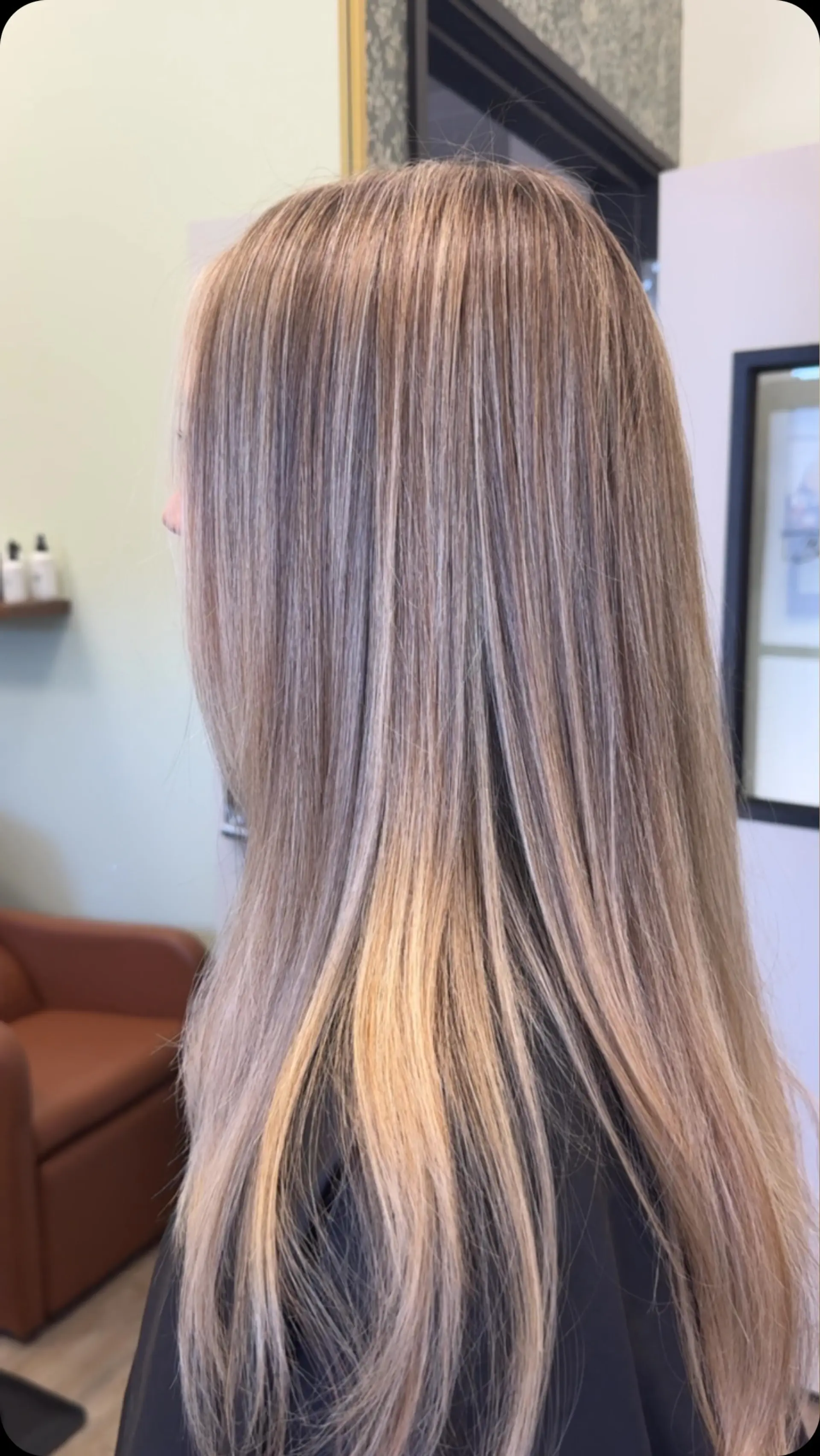 Long, smooth straight hair featuring finely blended multi-dimensional ash and beige blonde highlights. 1