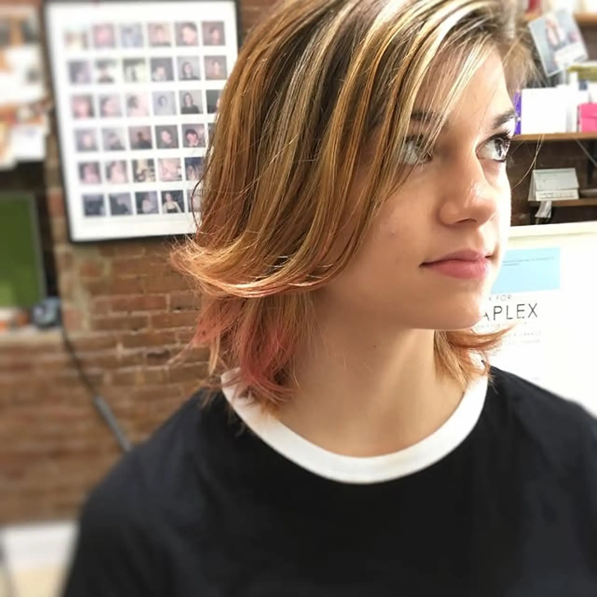 A modern layered bob with face-framing layers and subtle pink highlights for a trendy and easy-to-style look. 1