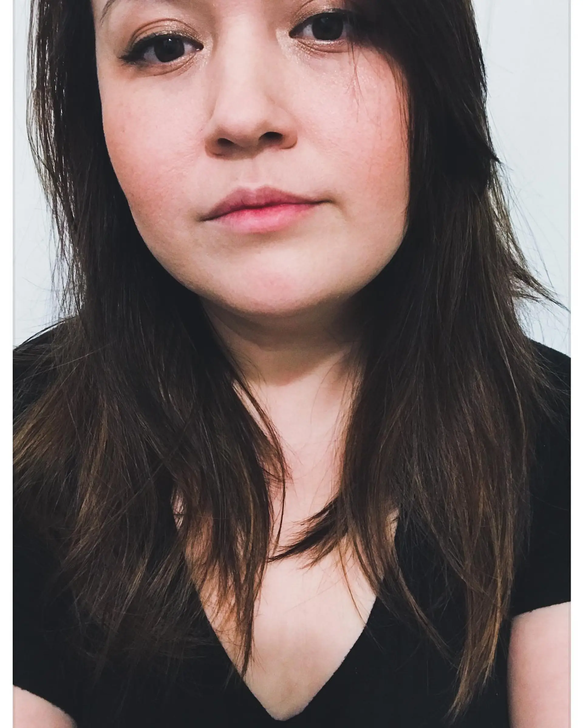 Long dark brown hair featuring soft face-framing layers and wispy textured ends. 1