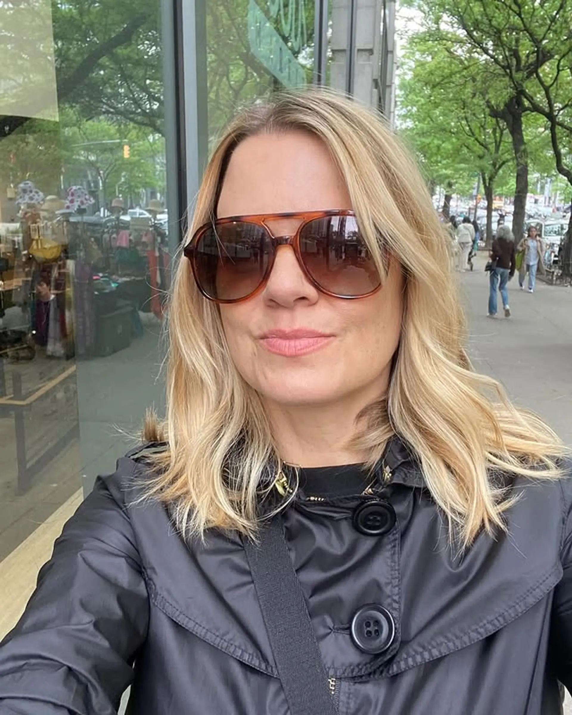 A medium-length, layered hairstyle featuring loose, beachy waves. 1