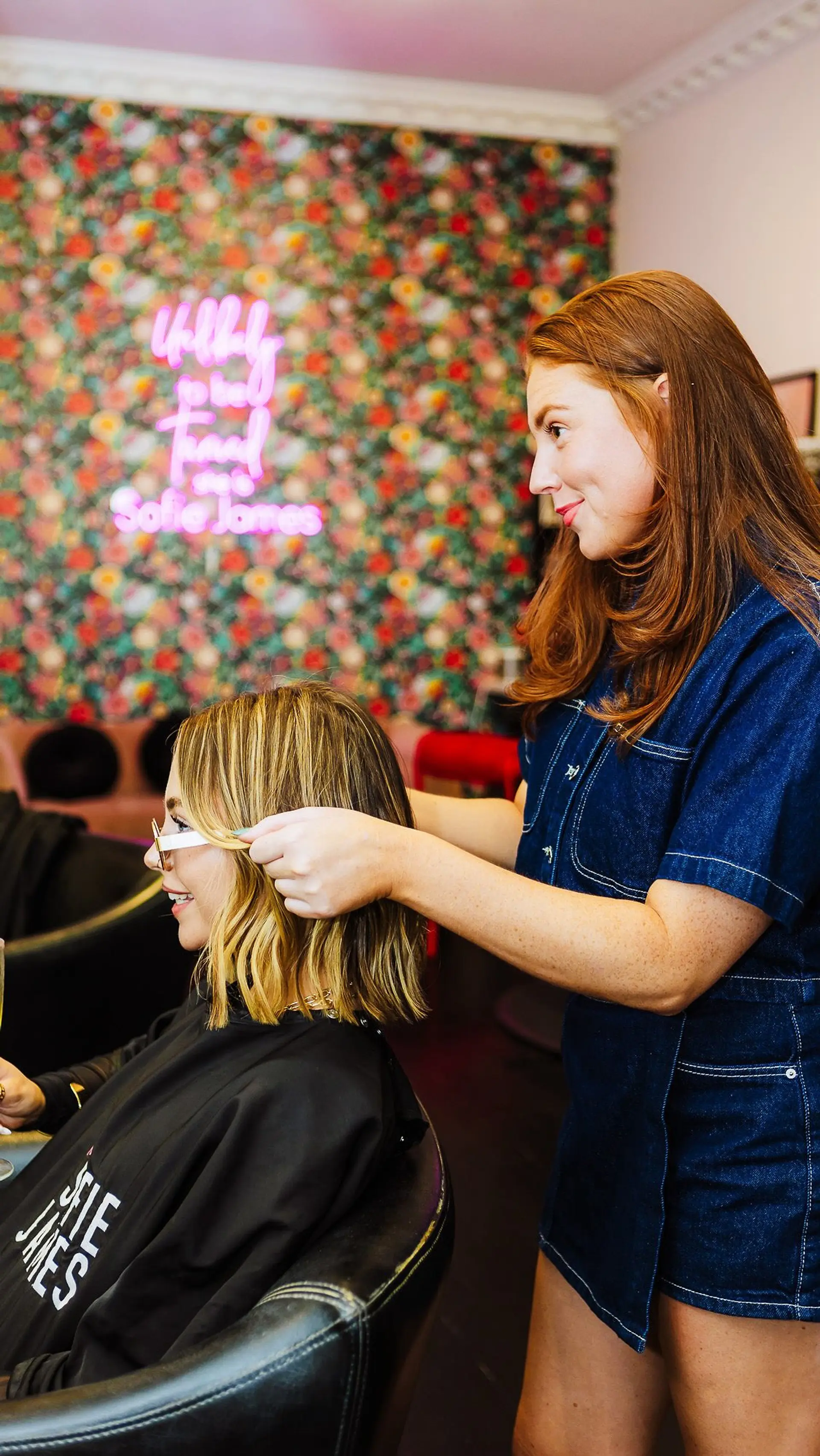 A textured, shoulder-grazing bob styled with relaxed loose waves and dimensional blonde balayage highlights over a natural darker base. 1
