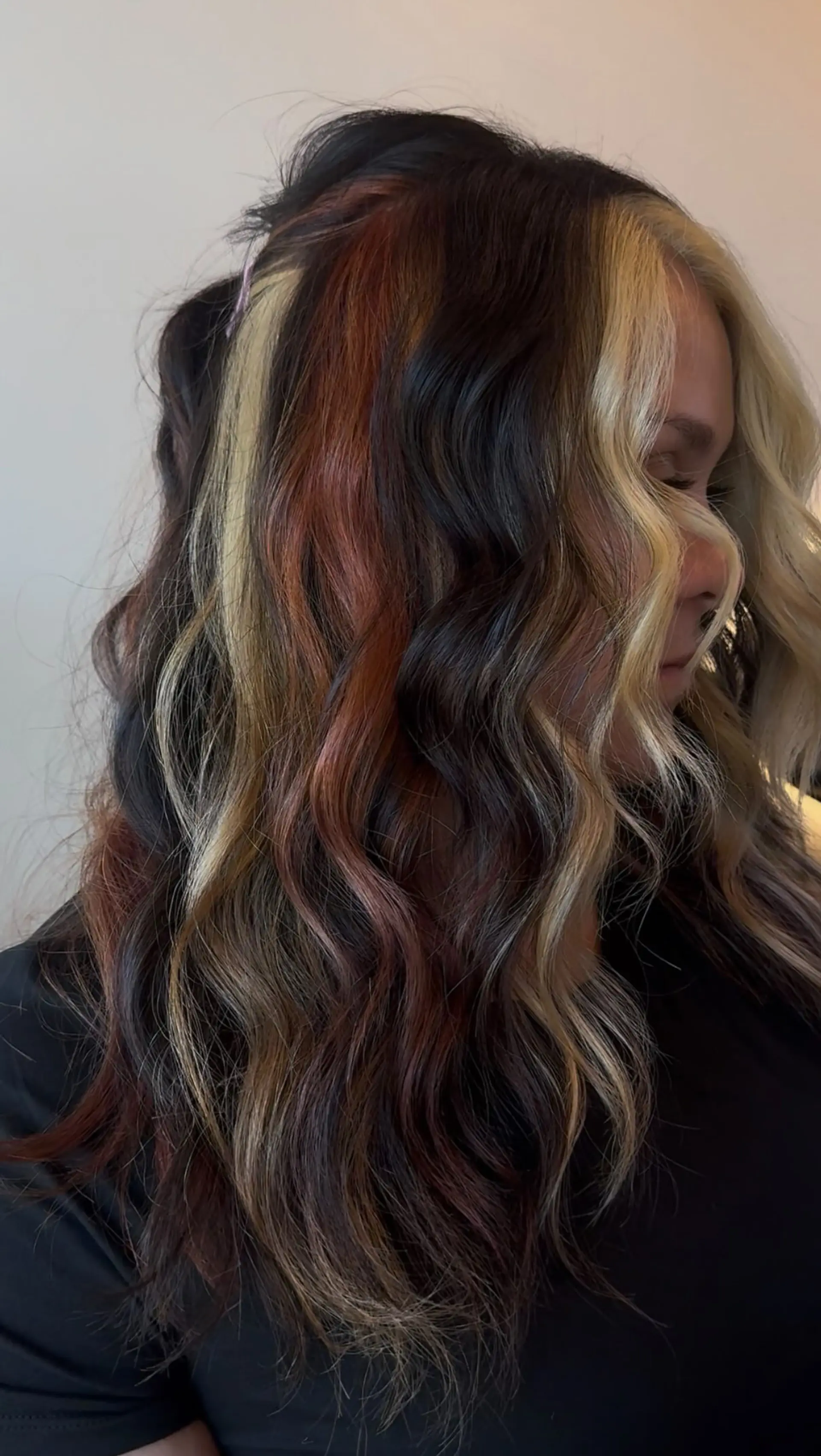 Medium-to-long styled waves featuring bold calico hair coloring with distinct sections of platinum blonde, copper red, and rich brunette. 1