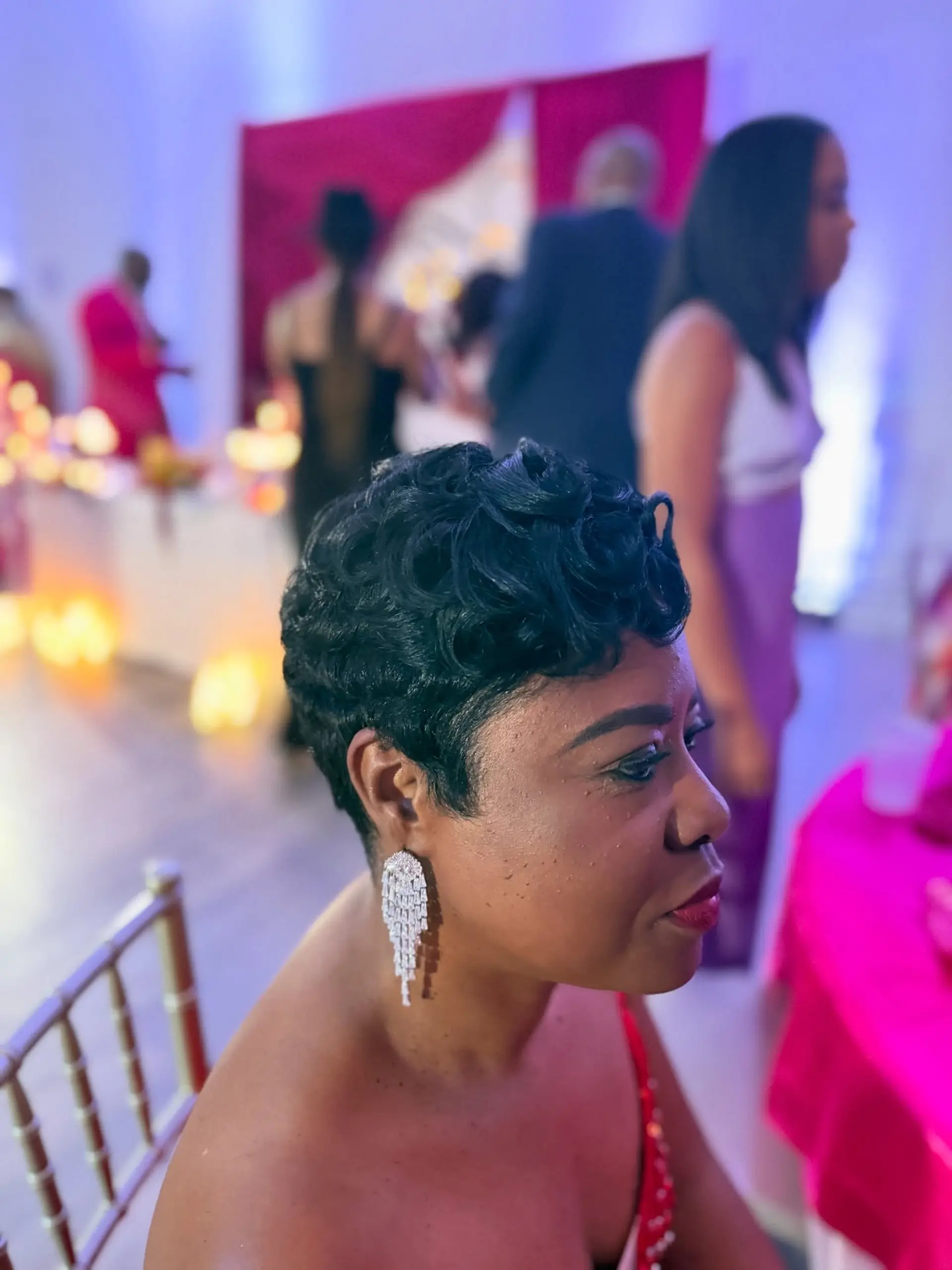 A sophisticated very short pixie cut featuring deeply defined, polished finger waves that beautifully frame the face and head, offering a timeless and elegant aesthetic. 3