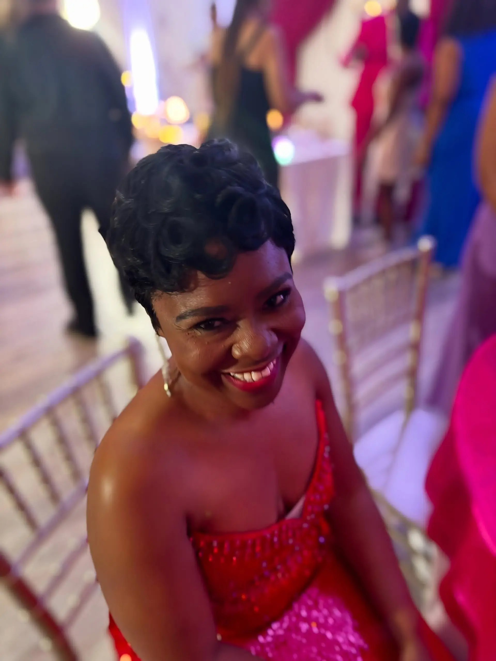 A sophisticated very short pixie cut featuring deeply defined, polished finger waves that beautifully frame the face and head, offering a timeless and elegant aesthetic. 4