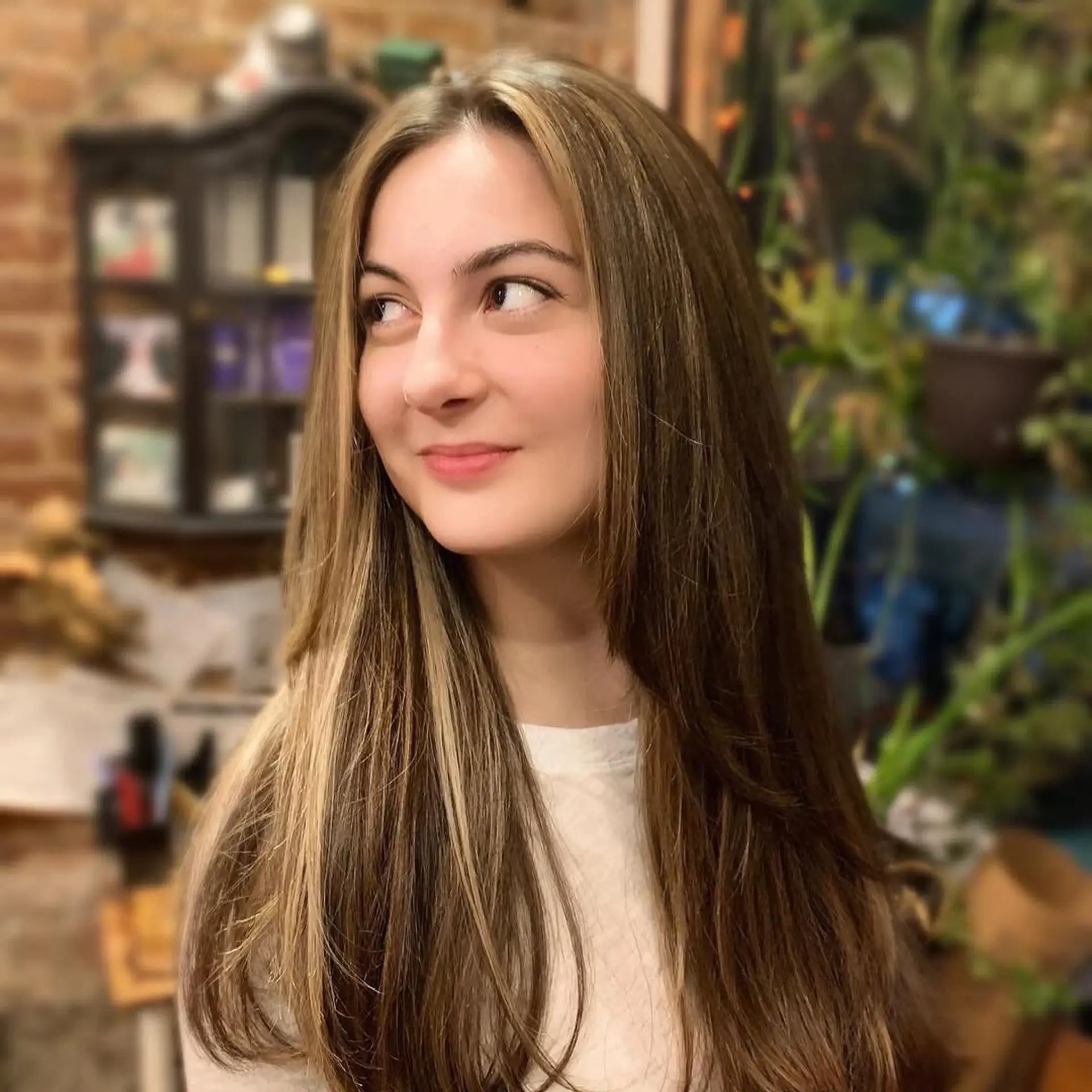 Long layered straight hair with bronde balayage and face-framing layers. 1