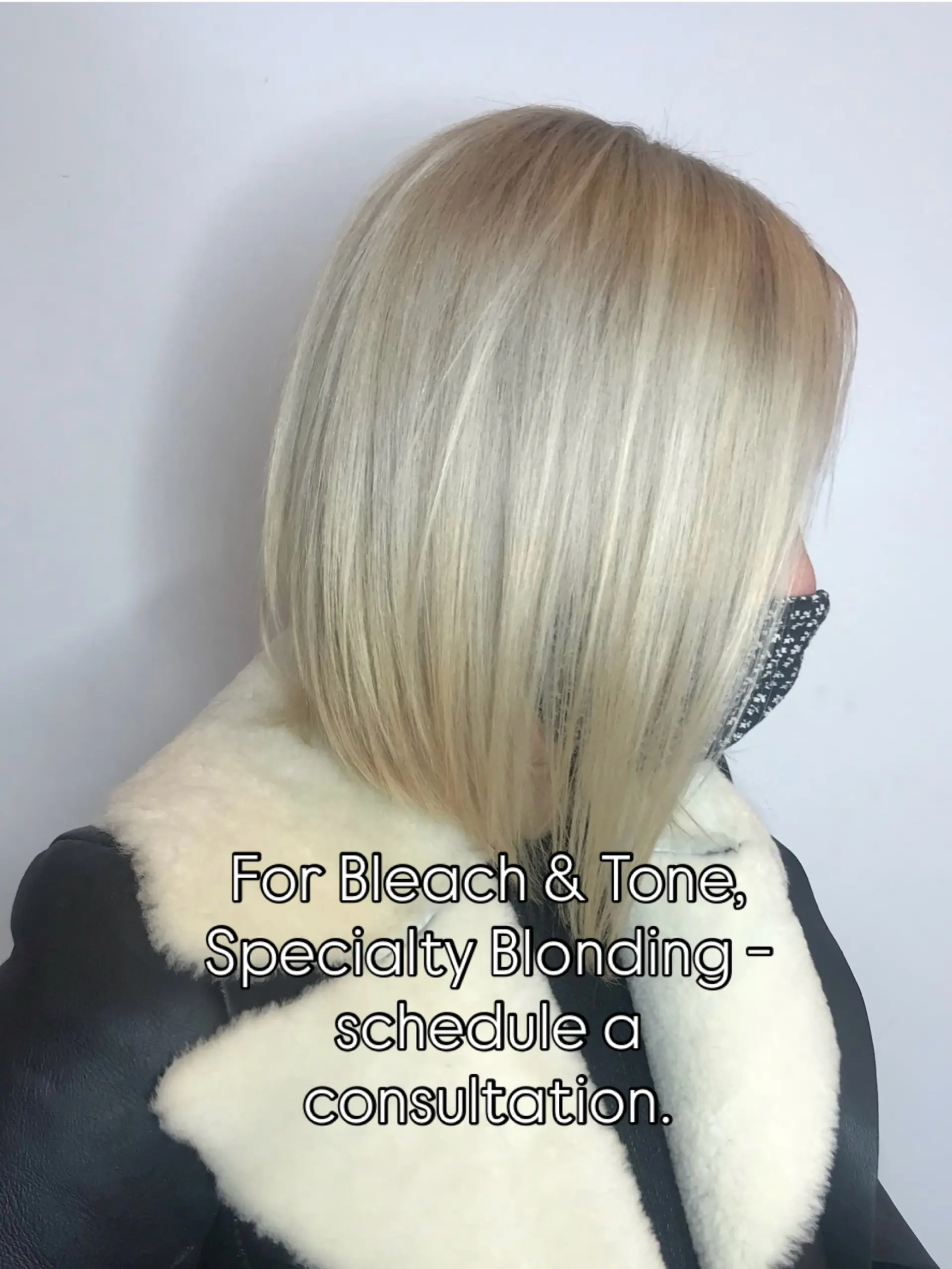 A sleek, straight angled bob featuring seamless, bright platinum blonde tones. 1