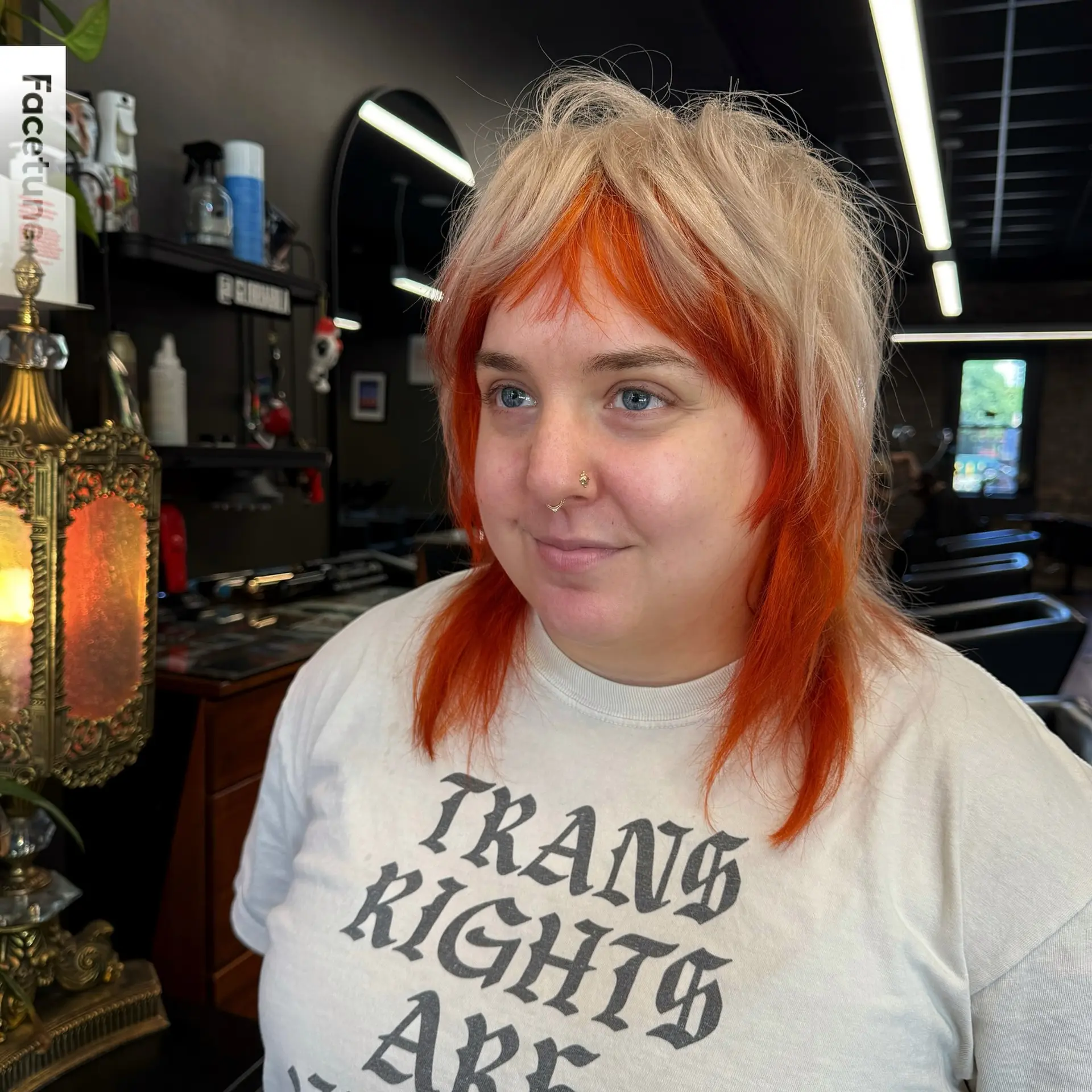 A textured two-tone shag mullet with platinum blonde layers over vibrant orange bangs and underlayers. 1