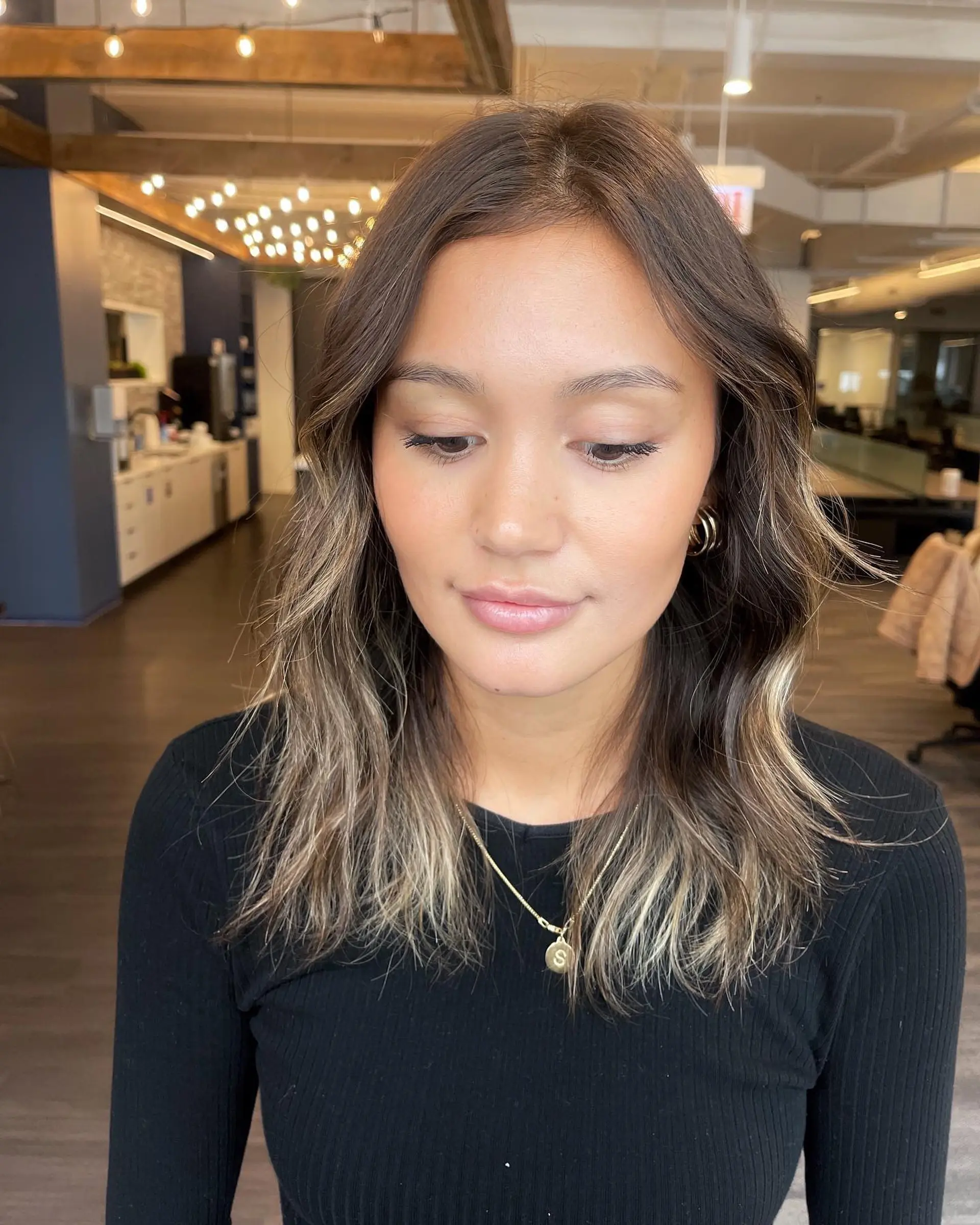 Long, layered wavy hair with a bronde balayage. 2
