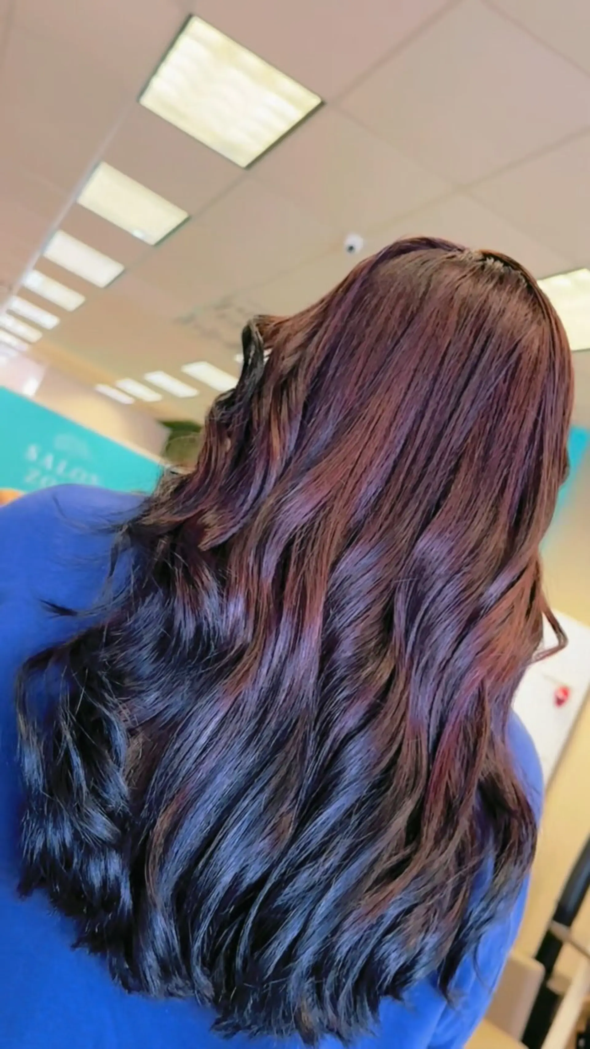 Long cascading waves in a rich deep burgundy tone transitioning into contrasting black dip-dyed tips. 1