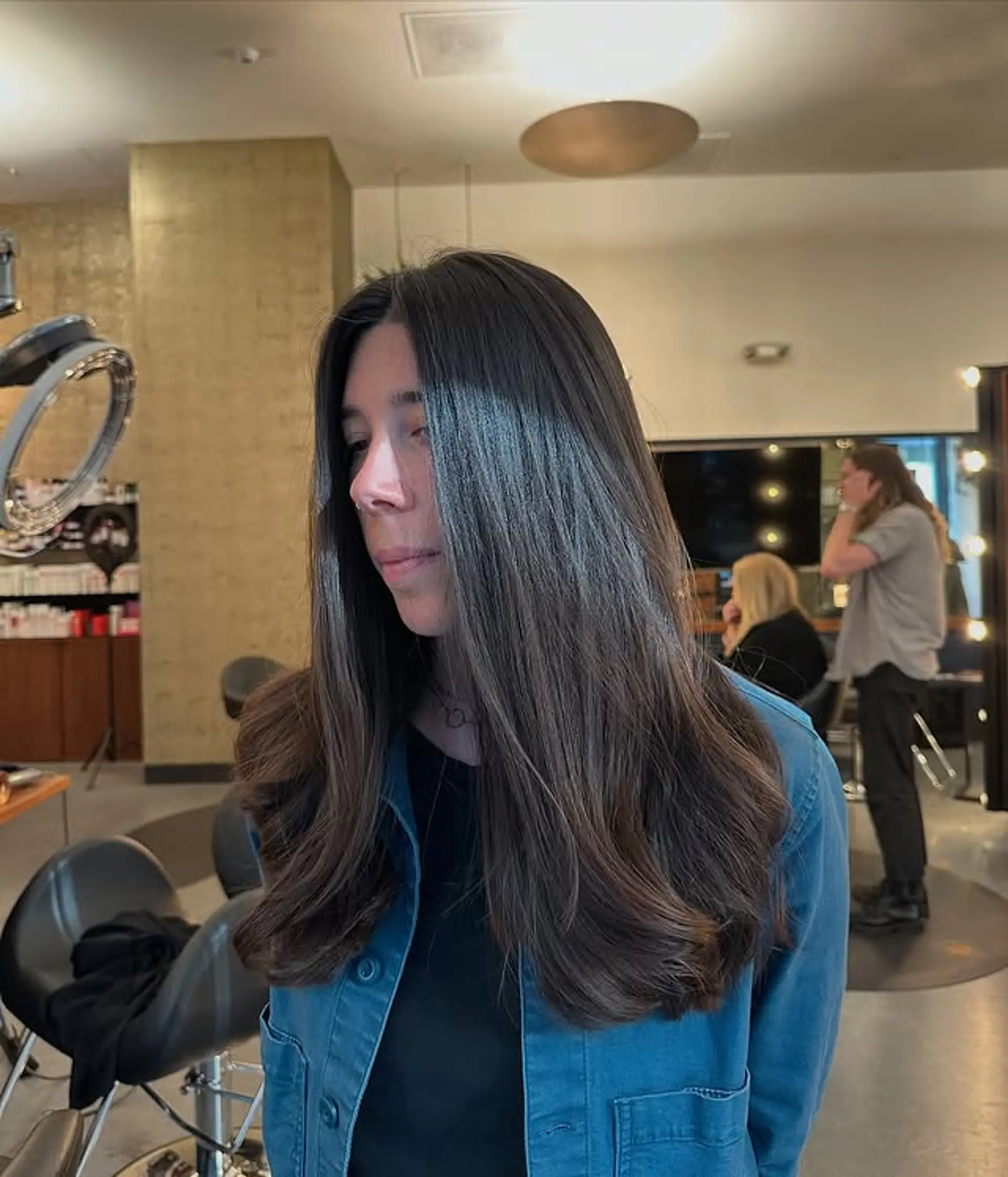 A long, layered haircut with face-framing layers. 1