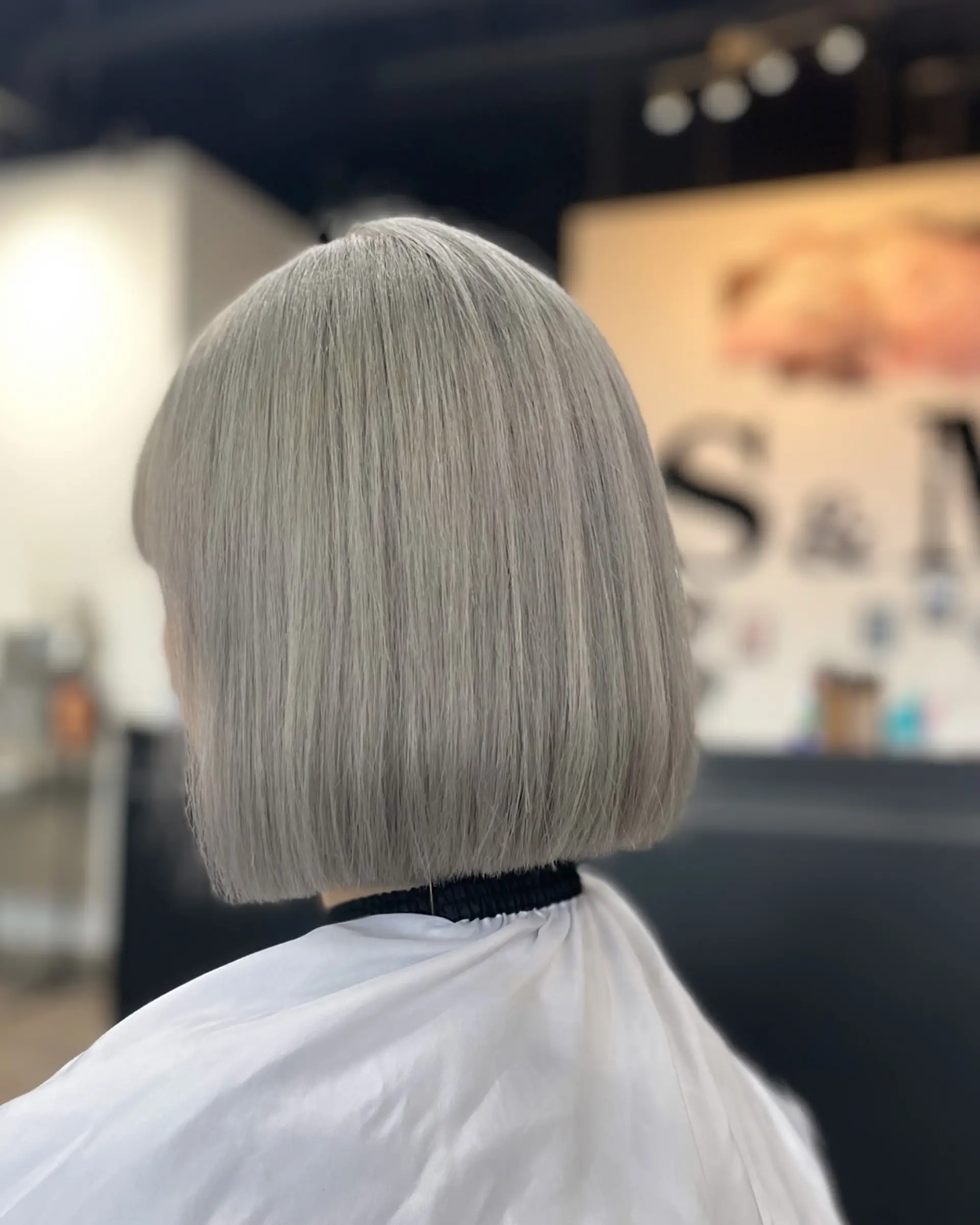 A sleek, medium-length bob with blunt bangs. 1