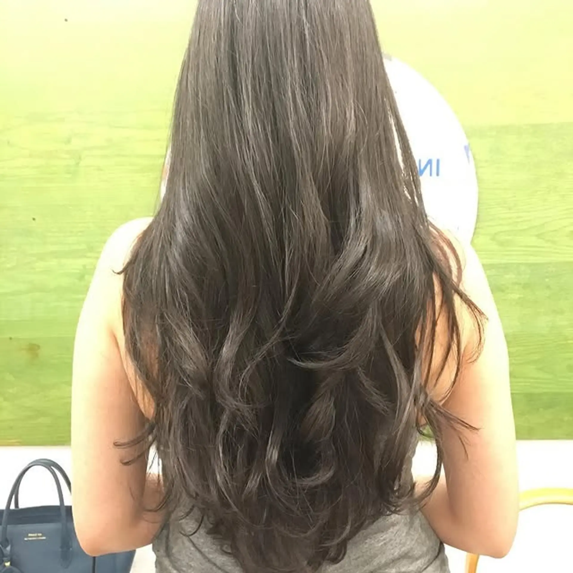 Long layered hairstyle with soft waves. 1