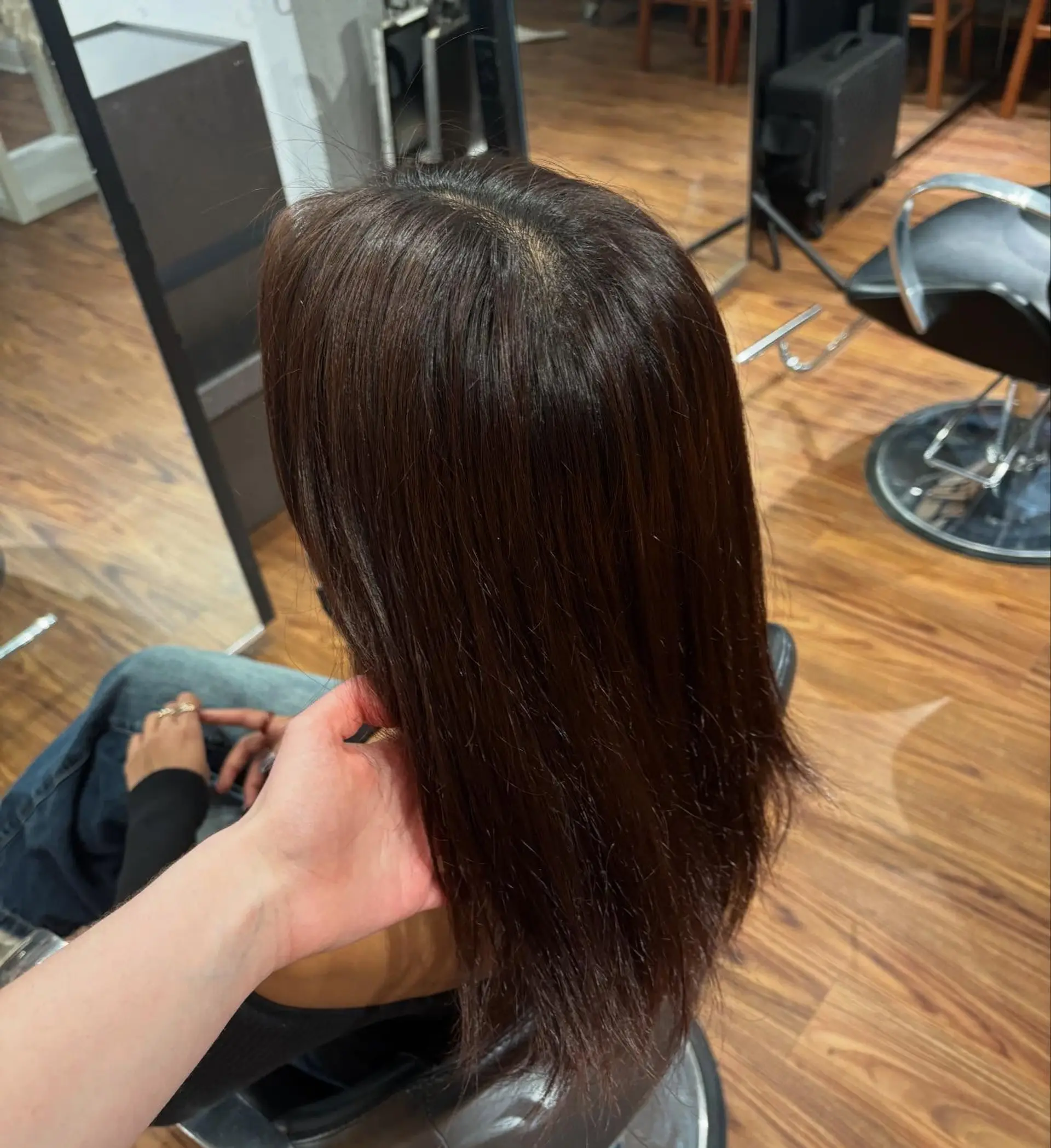A glossy, straight long dark brown hairstyle styled smoothly down the back. 1