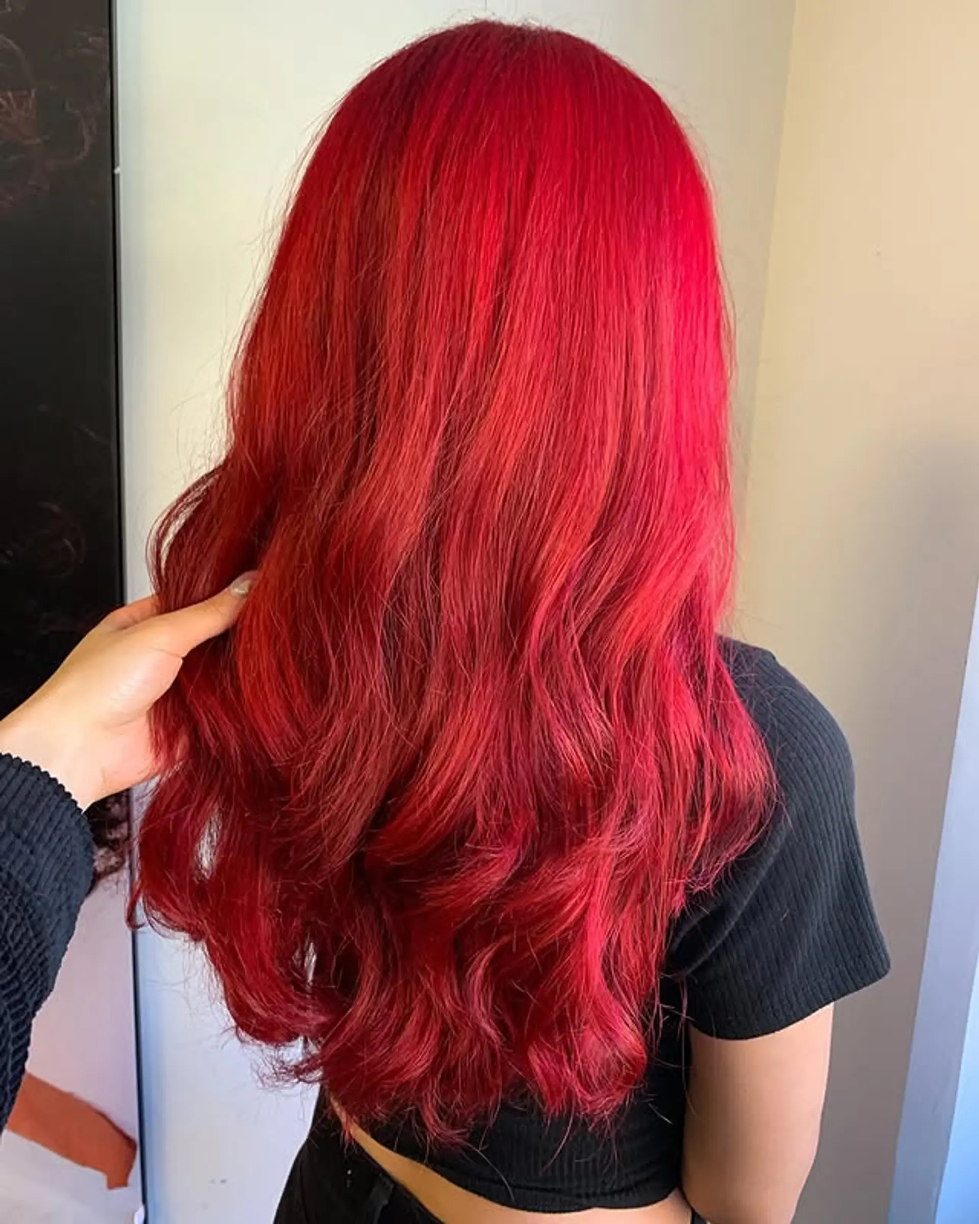 Long wavy hair with a red balayage. 1