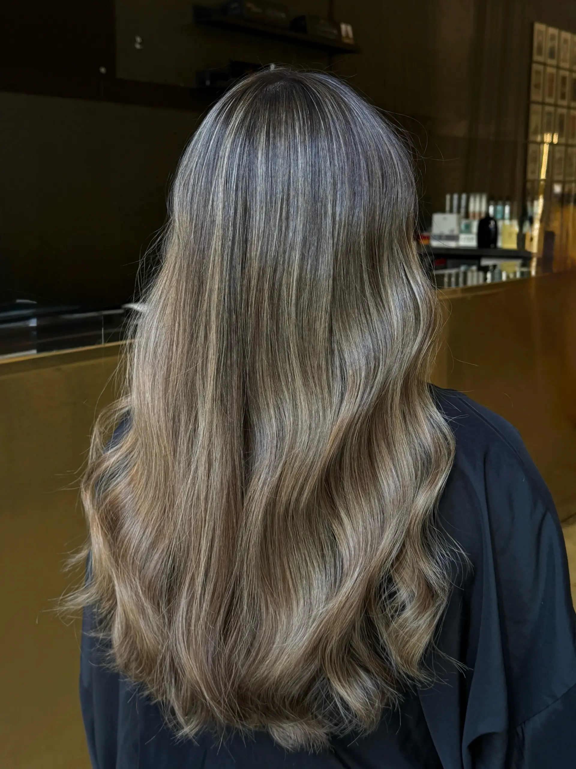 A soft, dimensional mushroom brunette color with seamless blending and natural-looking depth. 1