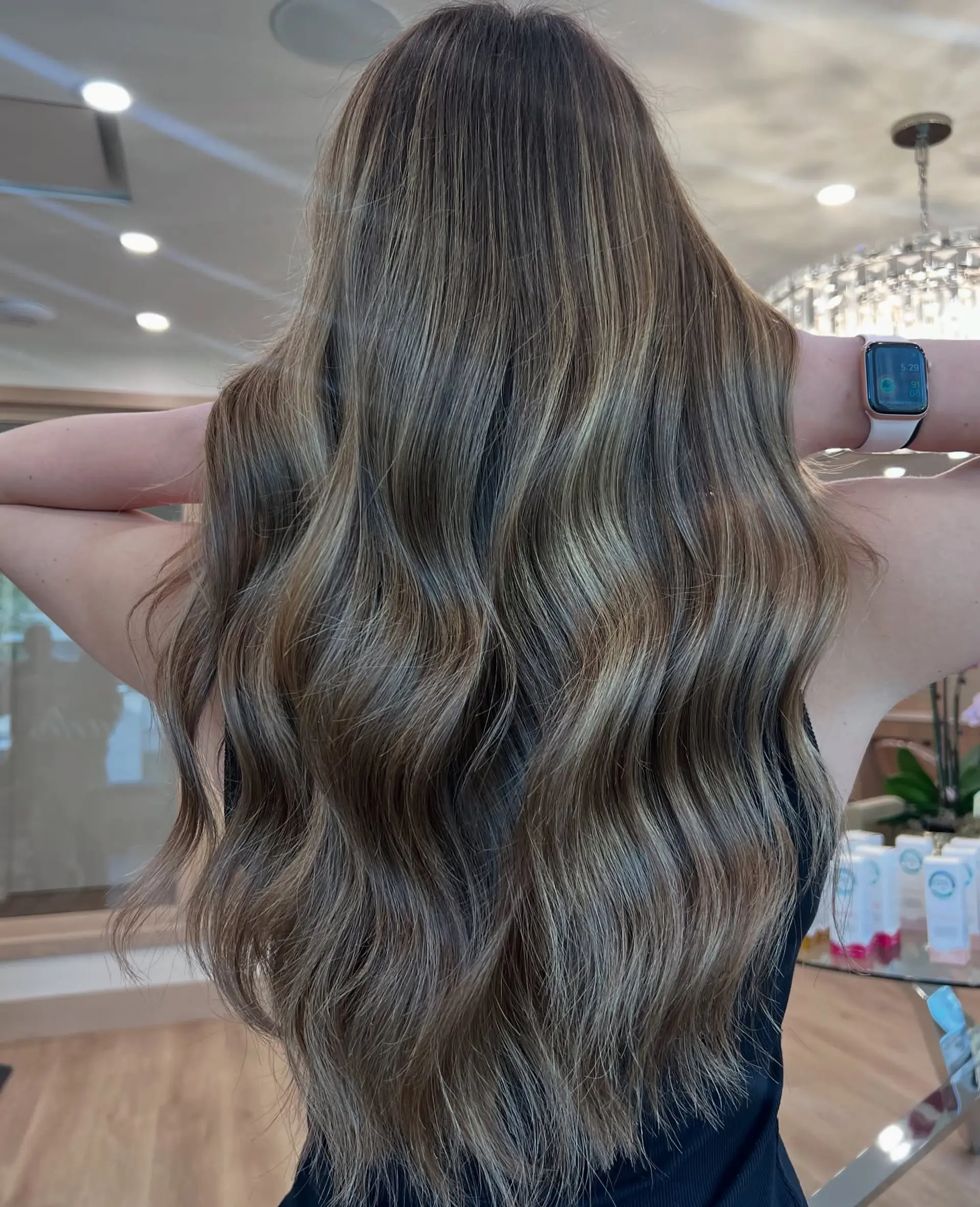 Long, flowing waves with a blend of brown and blonde hues. 1