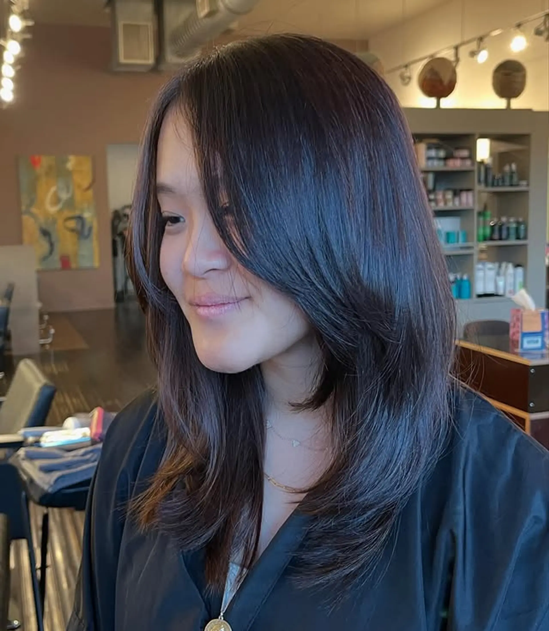 Long, layered haircut with face-framing layers. 1