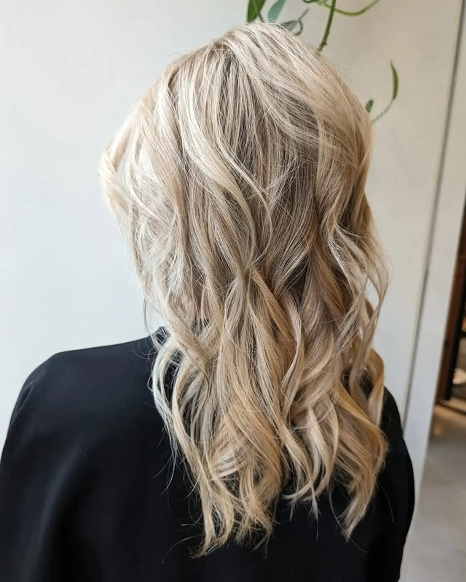 Long, layered wavy hair with beautiful blonde balayage. 1