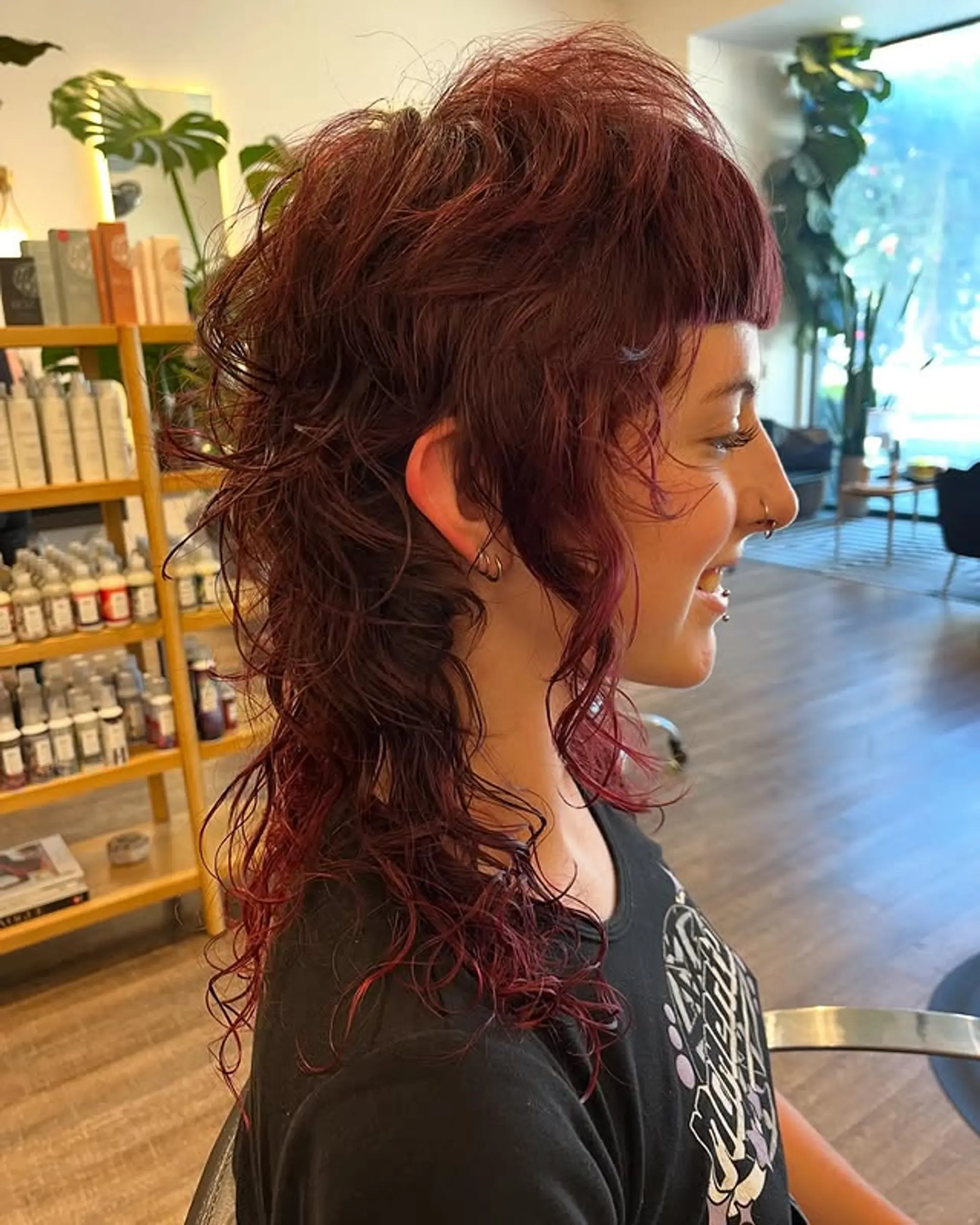 A shaggy mullet with micro bangs and choppy layers for a textured and edgy look. 1