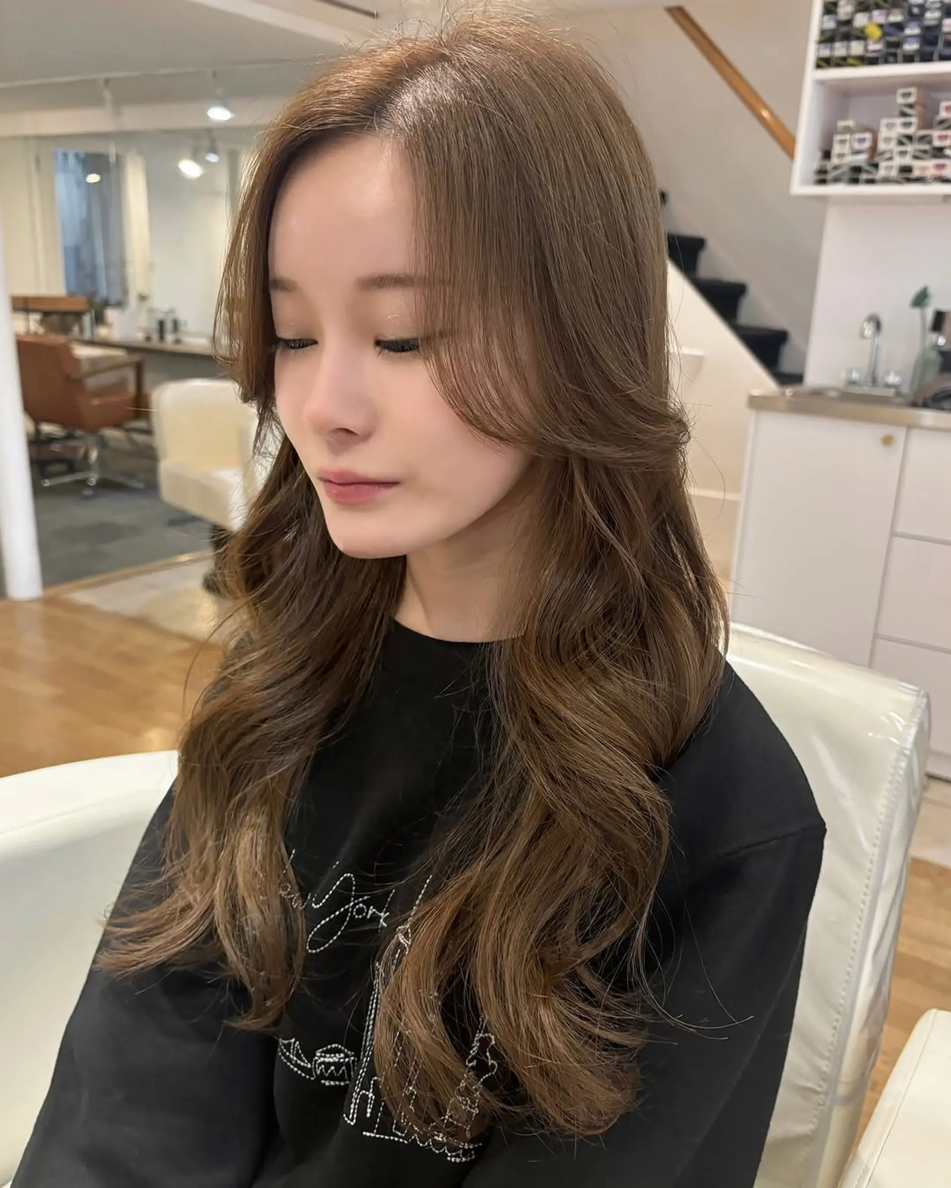 Long wavy hair with soft curls and face-framing layers. 1