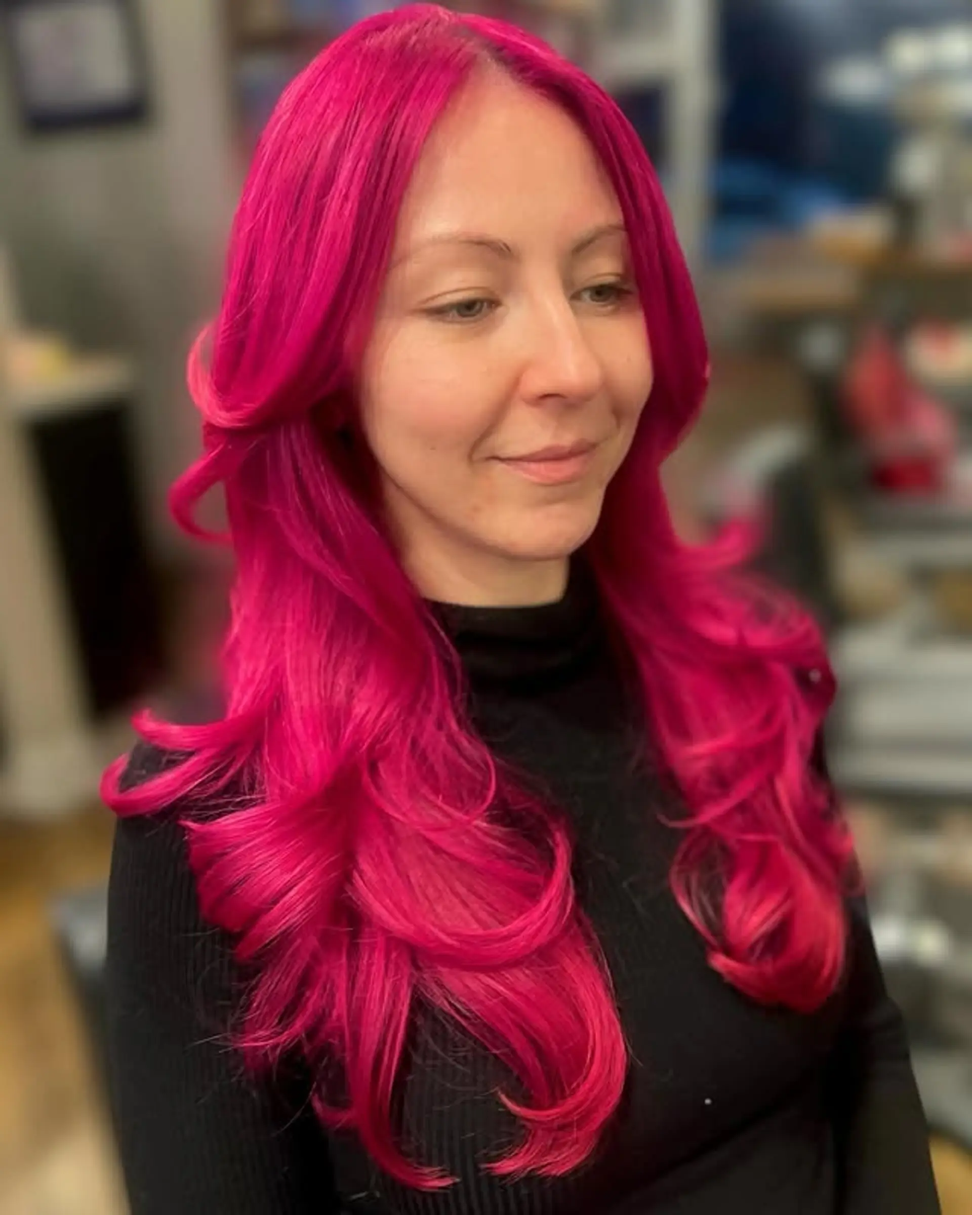 Long, wavy layered hairstyle with face-framing layers. 1